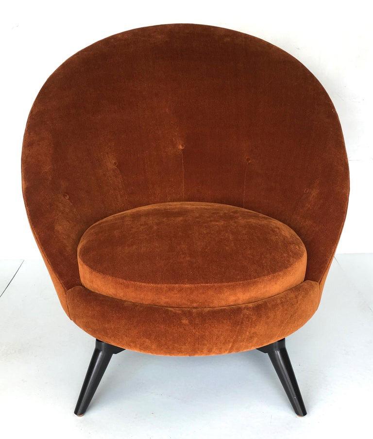 Pair of Swivel Lounge Chairs in Burnt Orange velvet on solid Maple bases in Espresso lacquer.  