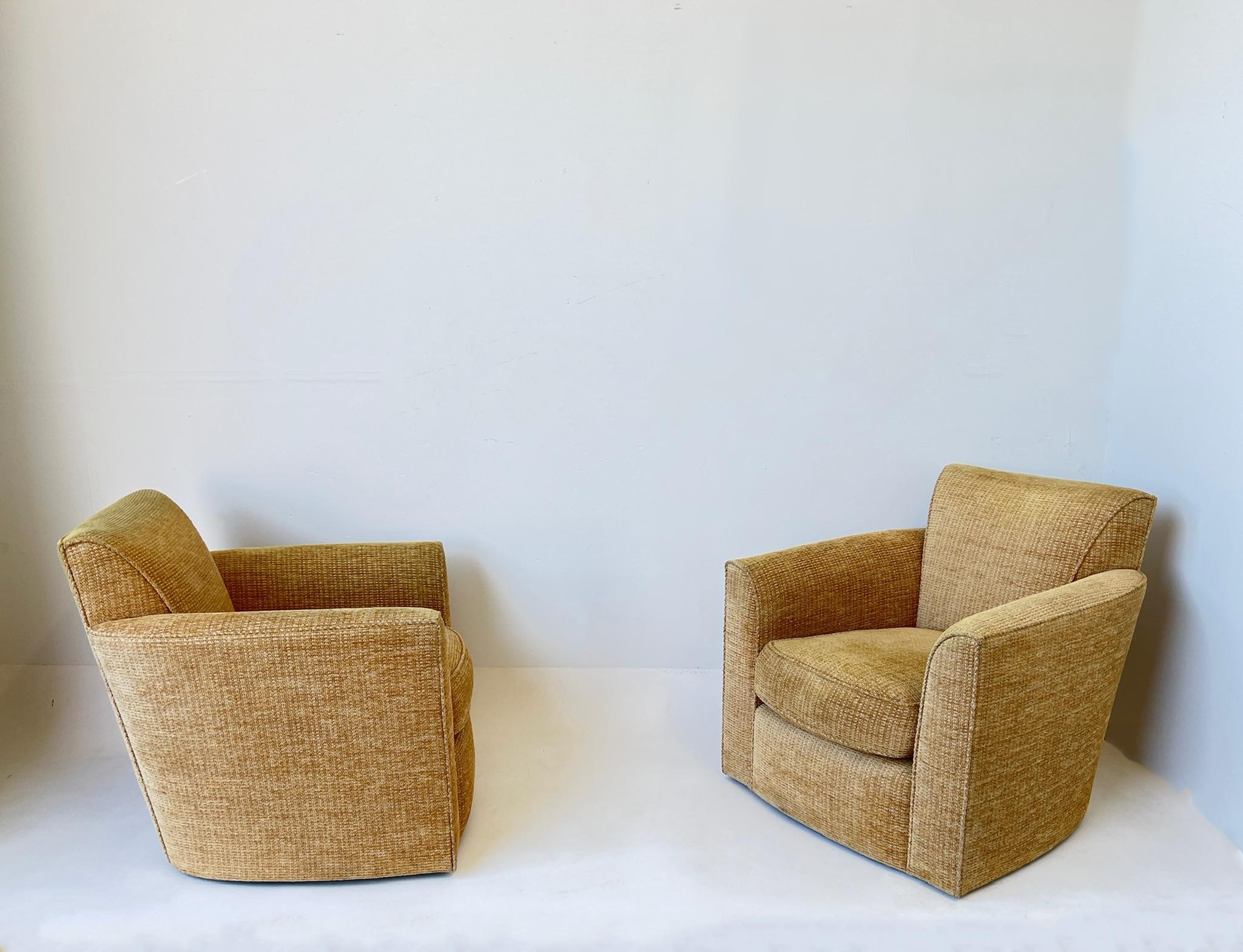 Pair of swivel lounge chairs and ottoman by Donghia. 
Original chenille Donghia fabric, seat cushions on chair and ottoman is down filled. 
In beautiful vintage condition. 


Measurements: 
chair- 31” wide, 33” deep, 31” high, 17” seat, 24”