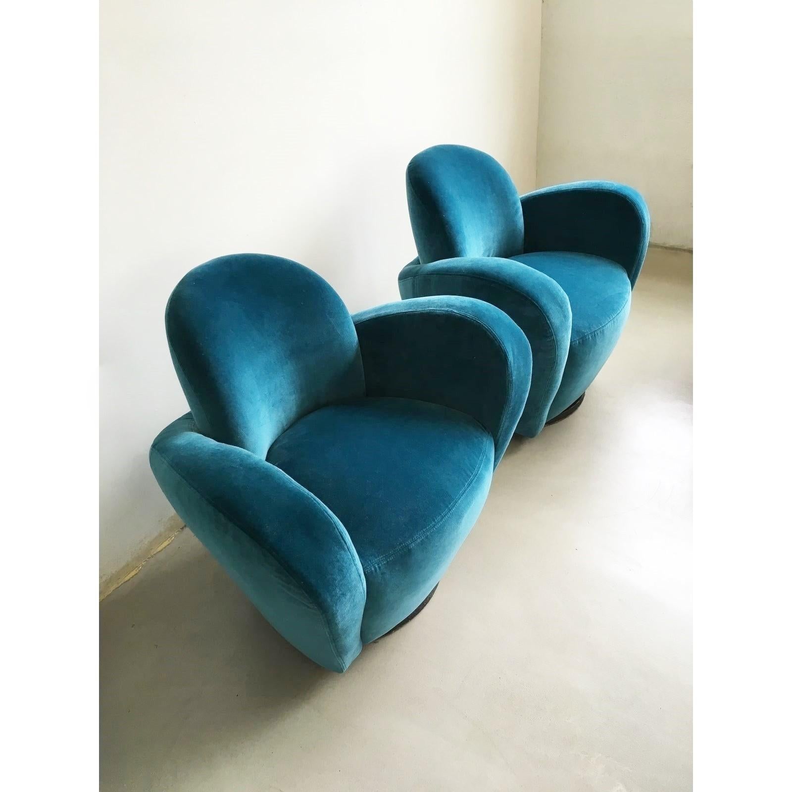Pair of wraparound swivel chairs designed by Directional, circa 1985. Ergonomic tulip-shaped chairs are super comfortable. Feature an exuberant and sexy design. Recovered in a stunning blue velvet.