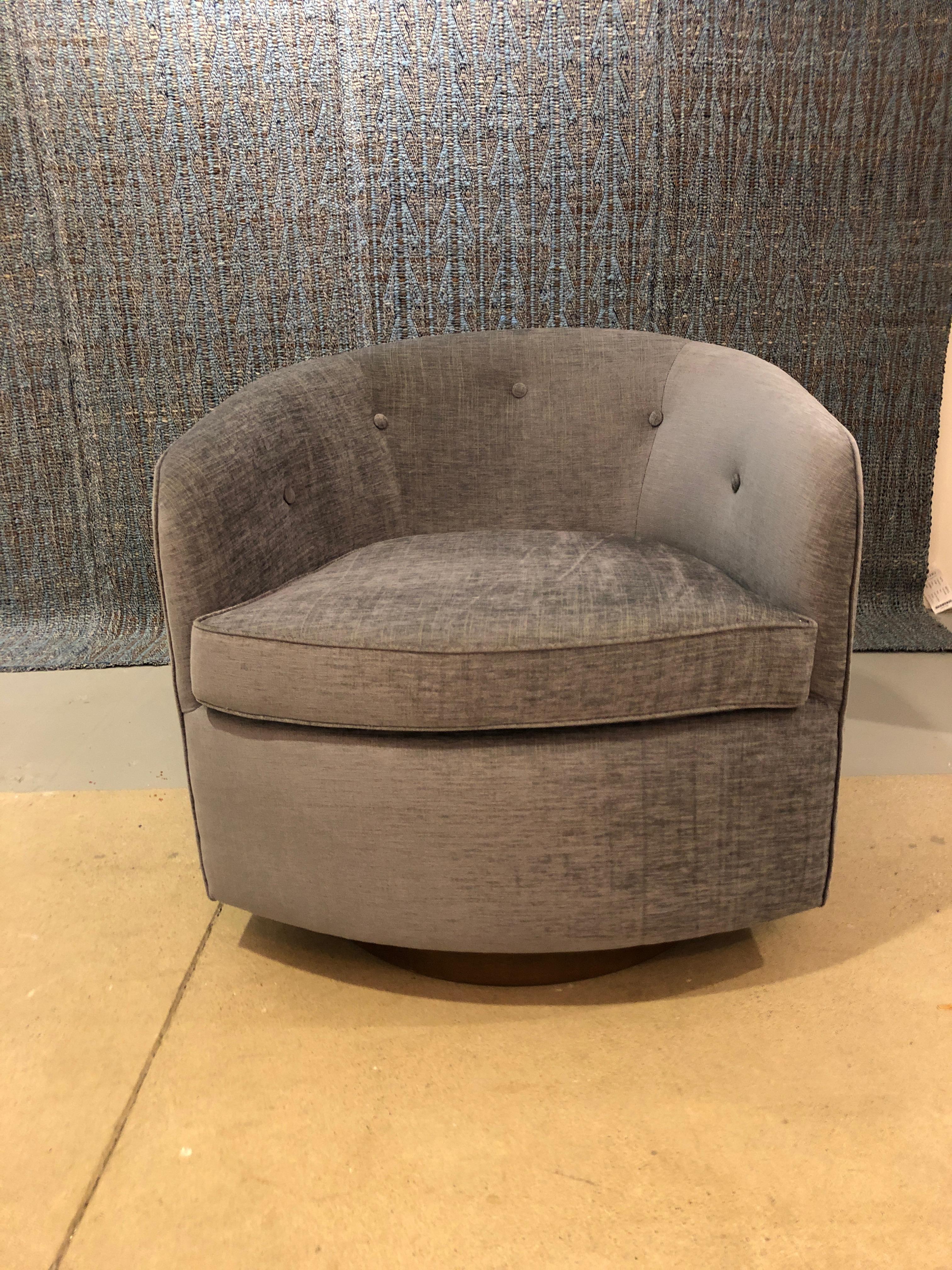 Pair of button backed lounge chairs shown in Saroma Plains chenille fabric (bluebell) on walnut swivel base. Available as shown (in stock) or available COM. Each chair requires 6 yards of fabric.