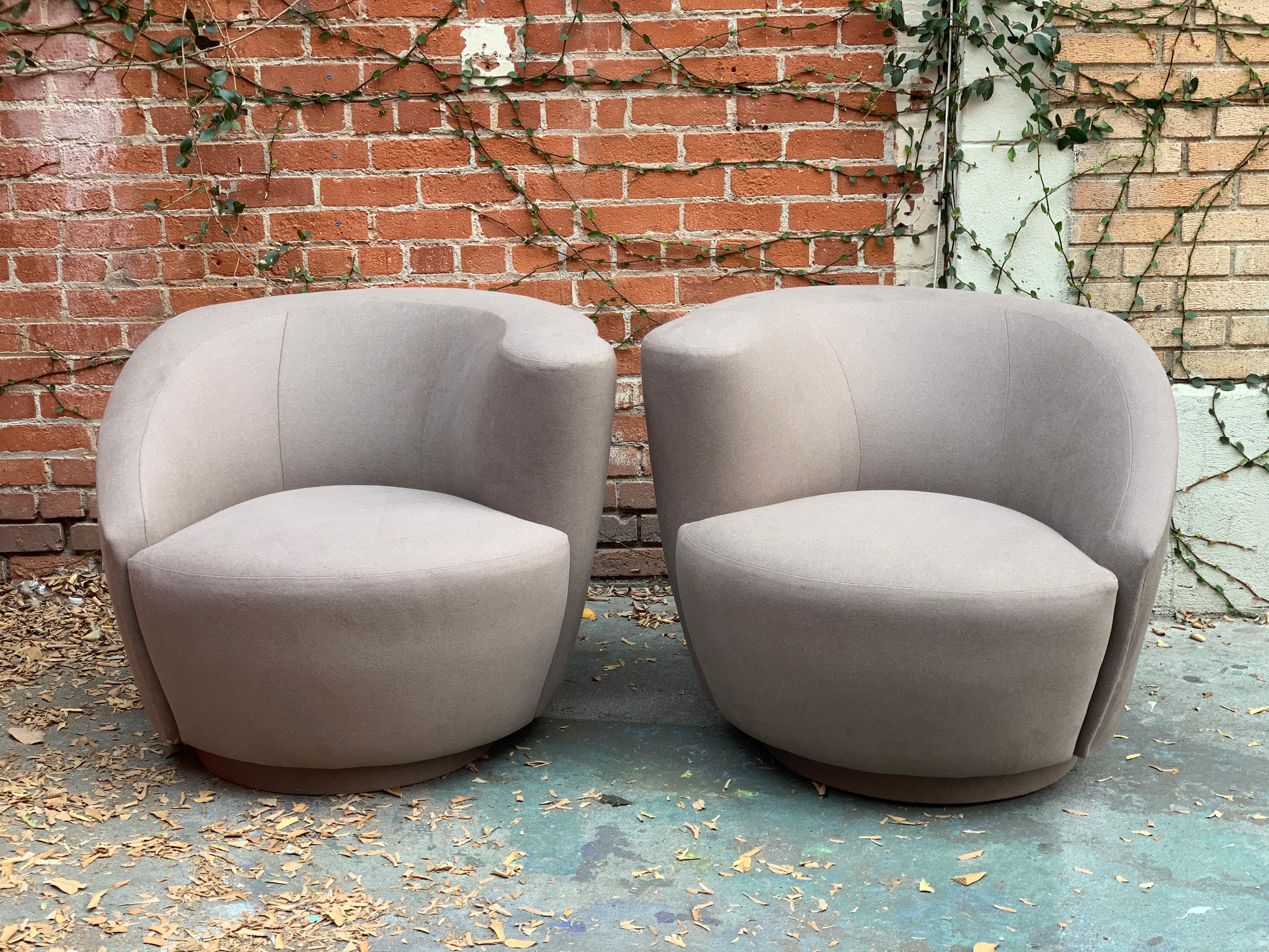 Vintage circa 1970s swivel parlor chairs upholstered in light grey wool.
True to color image of fabric shown in last image, recently reupholstered.

Measure: 21
