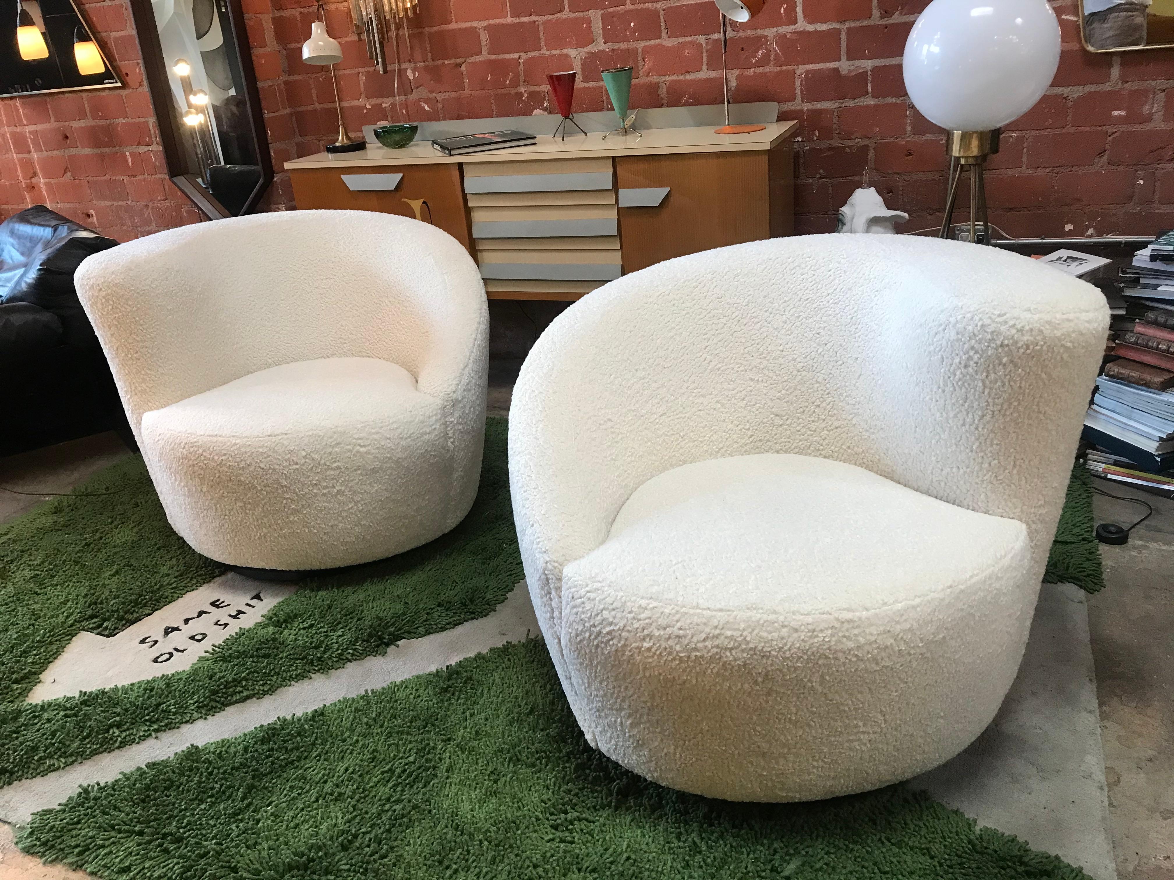 Stunning vintage circa 1960s swivel parlor chairs upholstered in white sheep fabric.

Measure: 21
