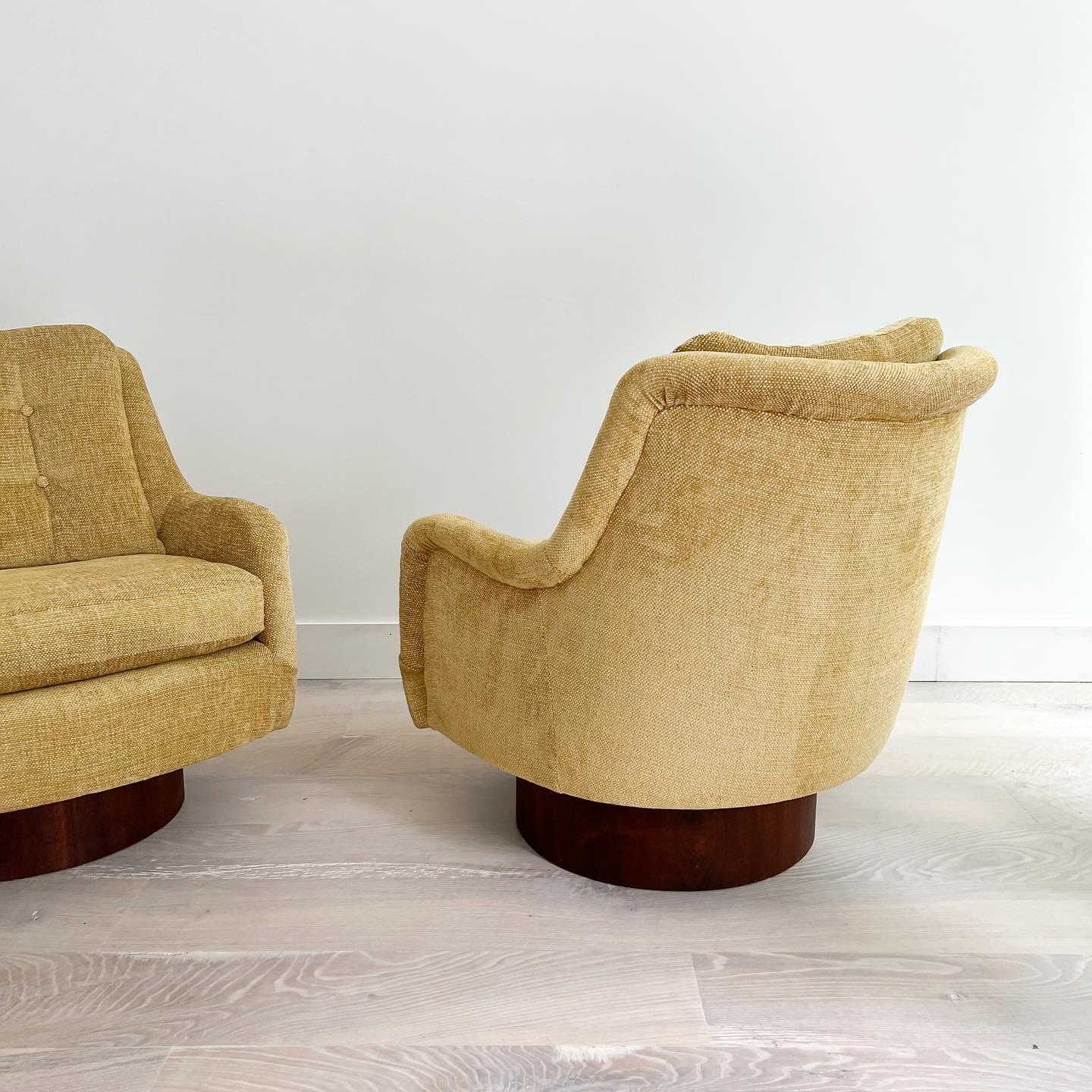 Pair of Mid-Century Modern swivel rockers with new golden yellow chenille upholstery. Attributed to Adrian Pearsall - The base construction is very similar to other Adrian Pearsall chairs we’ve had in the past. These chairs swivel and rock with