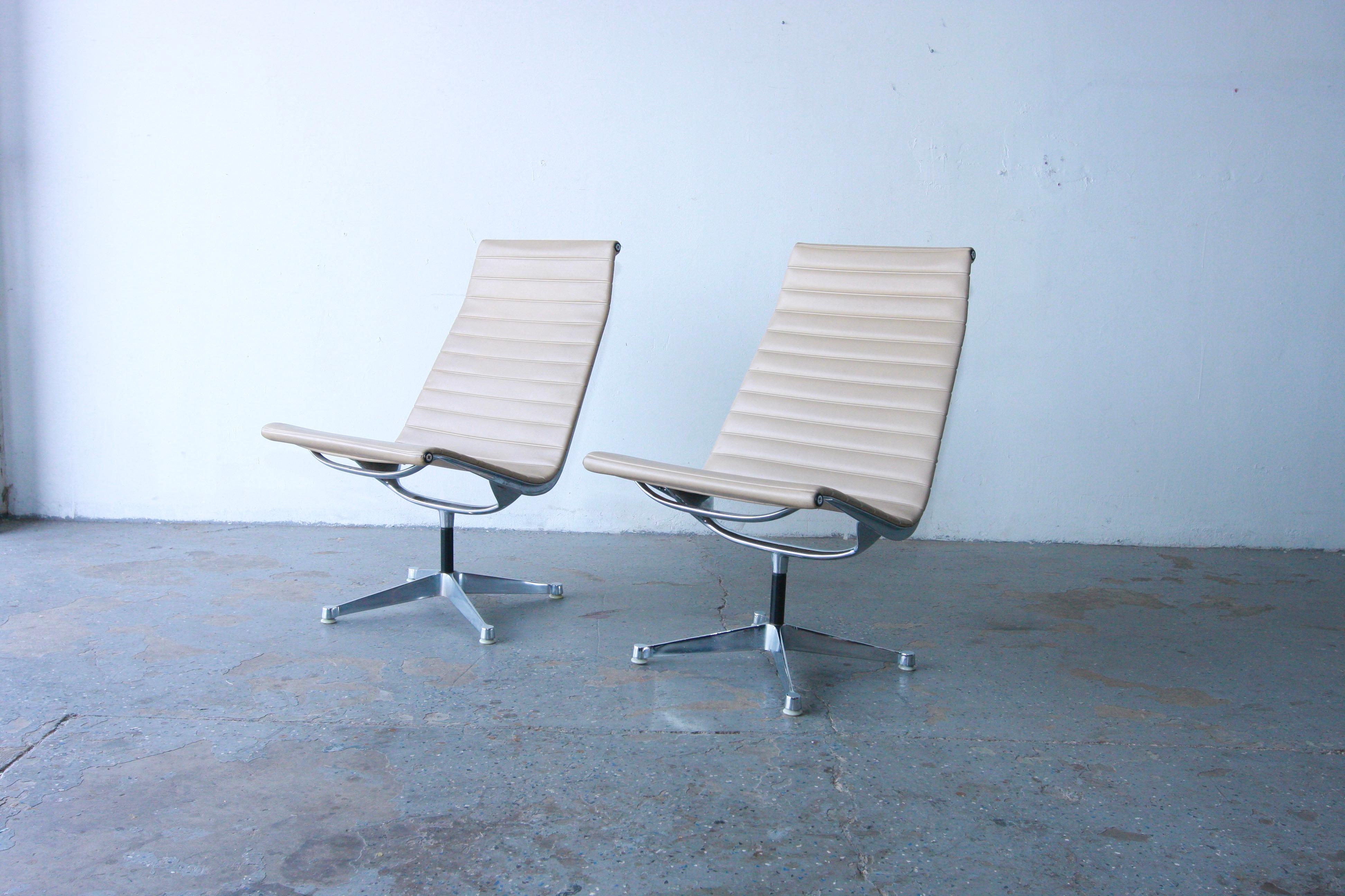 This is an original Iconic pair of Eames Aluminum Group Lounge Chairs designed by Charles and Ray Eames for Herman Miller in 1958. This  set was produced in the late 60’s or early 70’s . The pieces sport solid yet lightweight aluminum frames, and