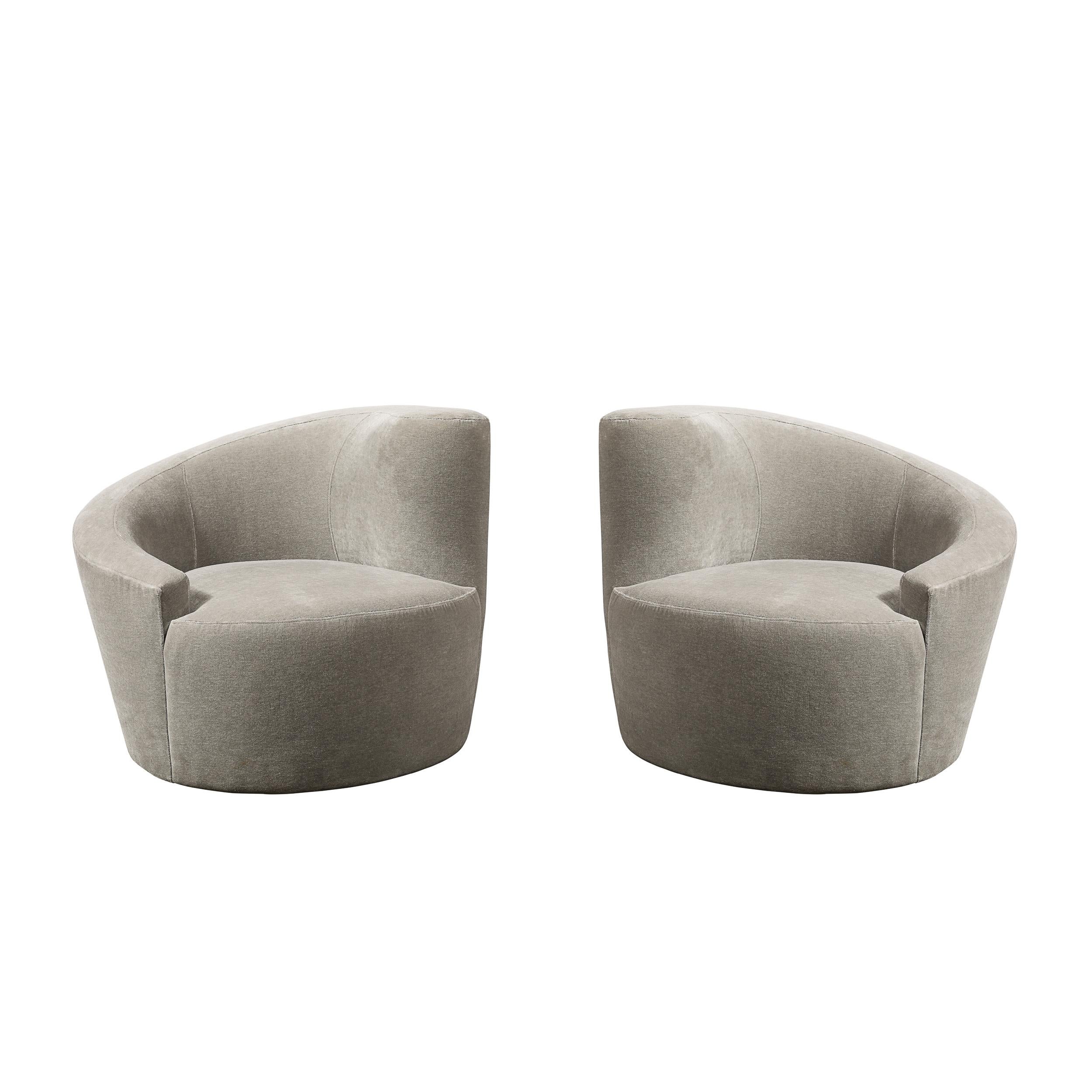 This beautiful pair of nautilus chairs exemplify the stunning organic futurist forms and clean lines for which Vladimir Kagan one of the most esteemed furniture designers of the 20th century is celebrated. The chairs' form suggests an abstracted