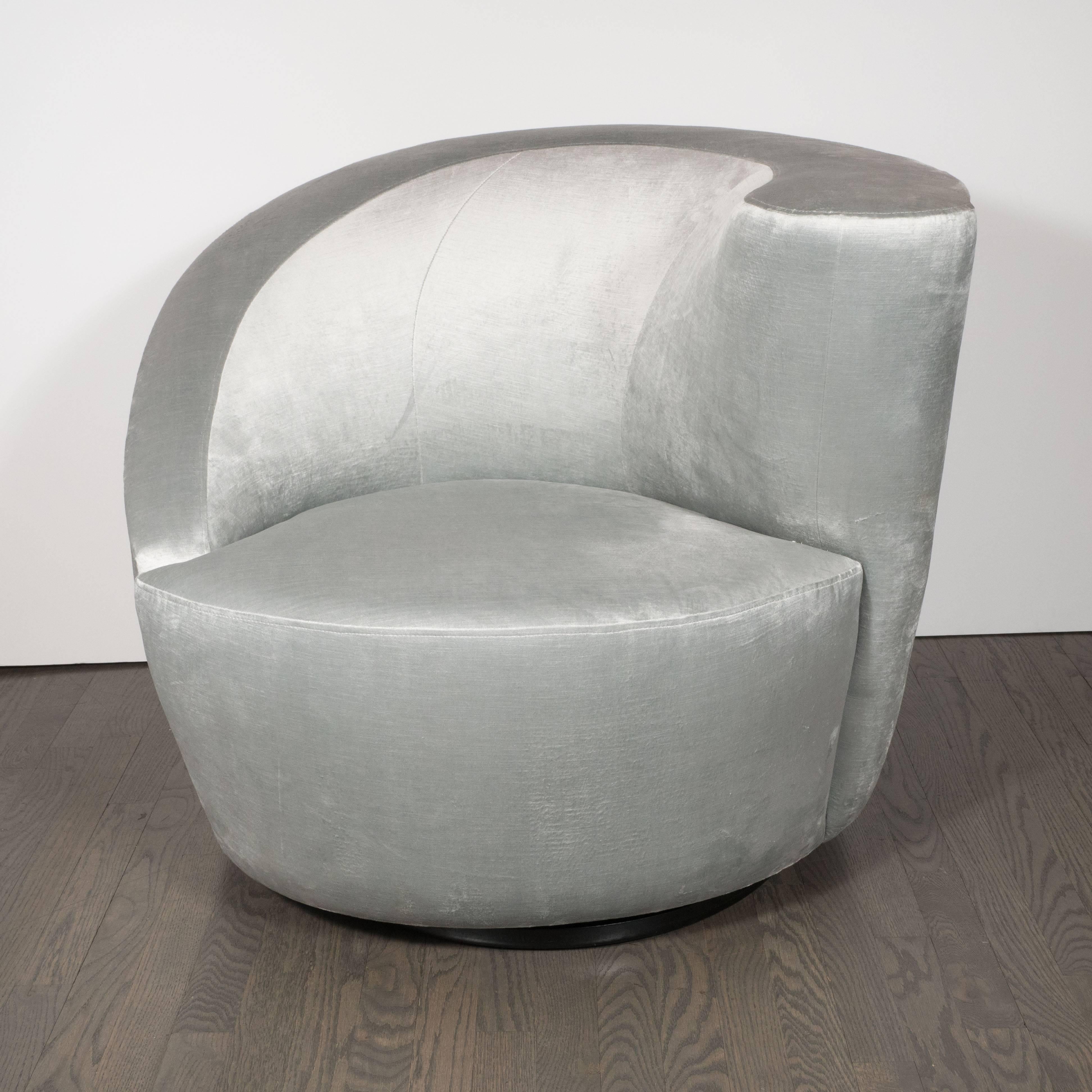 This pair of Nautilus chairs exemplify the stunning organic futurist forms and clean lines for which Vladimir Kagan one of the most esteemed furniture designers of the 20th century is celebrated. The chairs' form suggests an abstracted