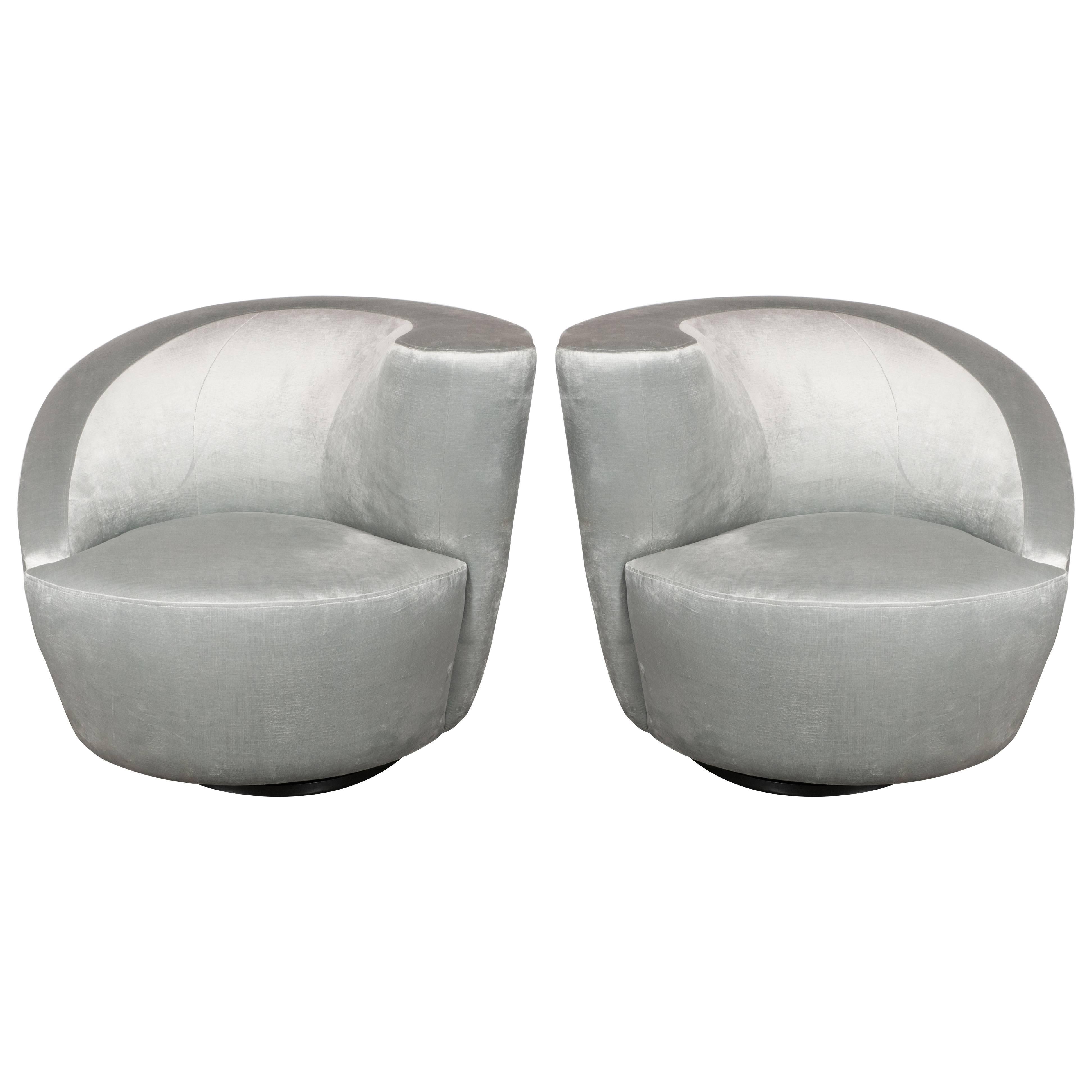 This pair of Nautilus chairs exemplify the stunning organic futurist forms and clean lines for which Vladimir Kagan one of the most esteemed furniture designers of the 20th century is celebrated. The chairs' form suggests an abstracted