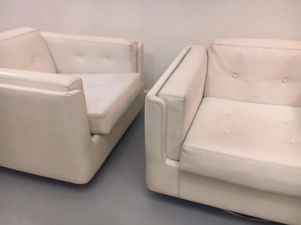 Pair of Swiveling White Faux Leather 