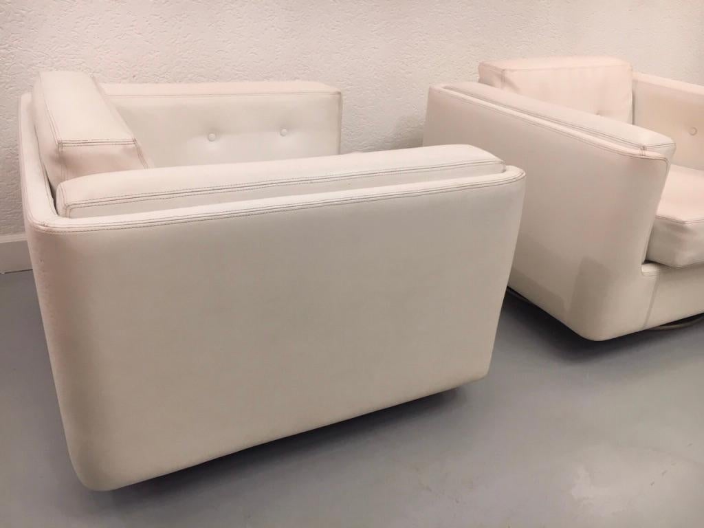Pair of Swiveling White Faux Leather 