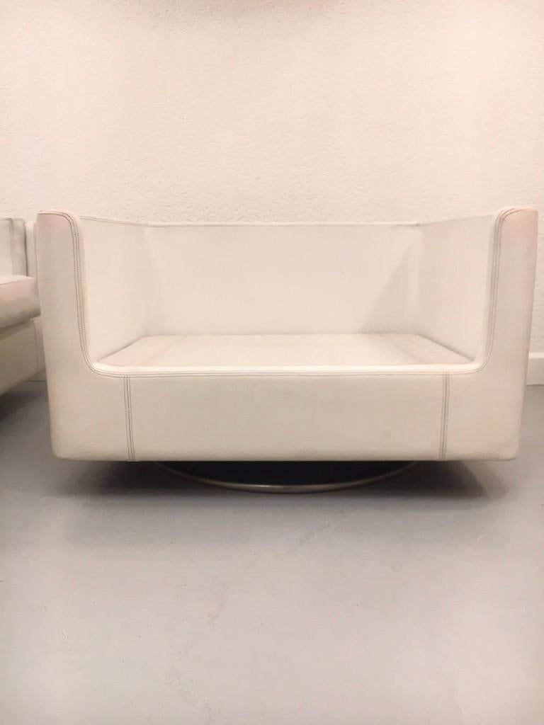 Pair of Swiveling White Faux Leather 