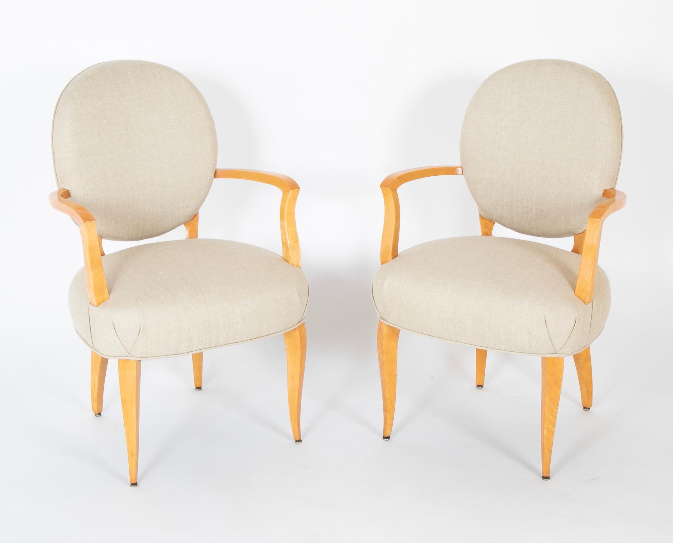A pair of Sycamore open armchairs attributed to Raphael Raffel (French, 1912-2000) newly upholstered in Rogers & Goffgon fabric.  Circa 1940's-1950's.