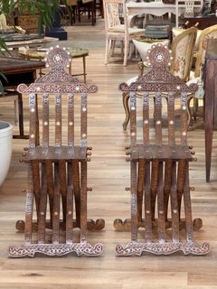 Pair of Syrian Damascus carved walnut folding chairs, c. 1900