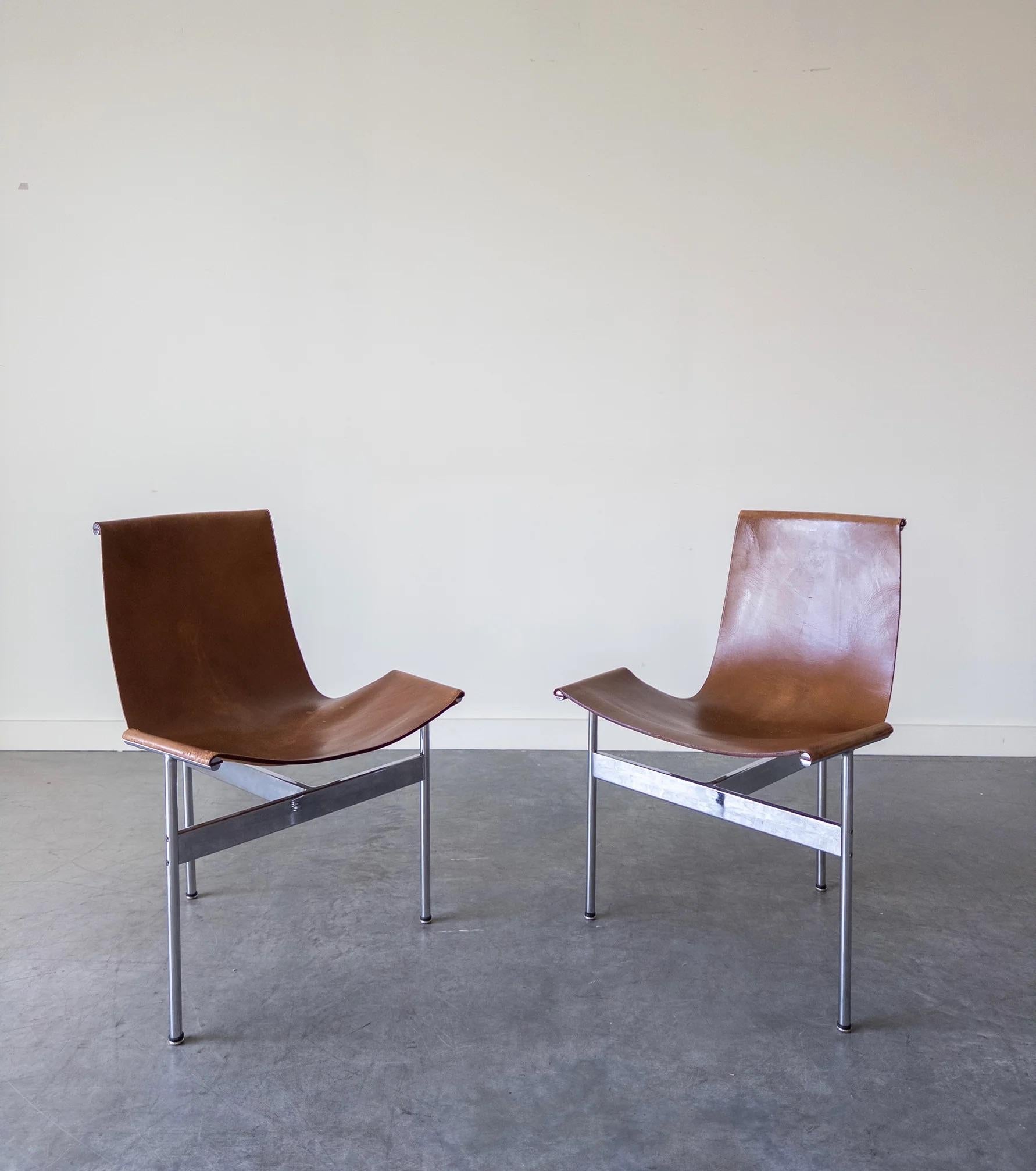 Original T chairs with chromed steel frames and the original cognac leather sling seat.
