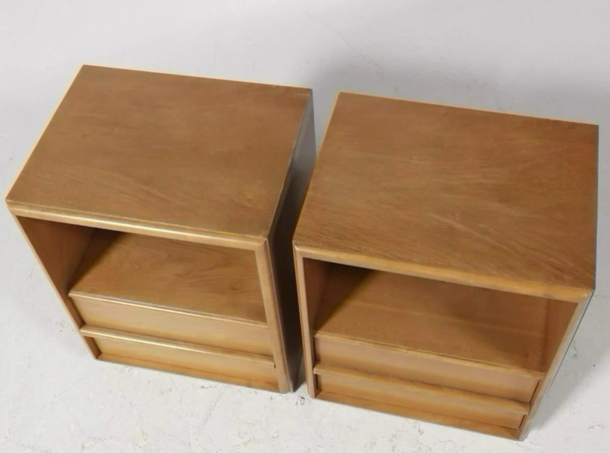 Pair of iconic bleached walnut nightstands by T.H. Robsjohn-Gibbings for Widdicomb. Single drawer with intrinsic walnut pull and open top compartment. Currently in the original bleached walnut finish, we can however refinish these in a darker color