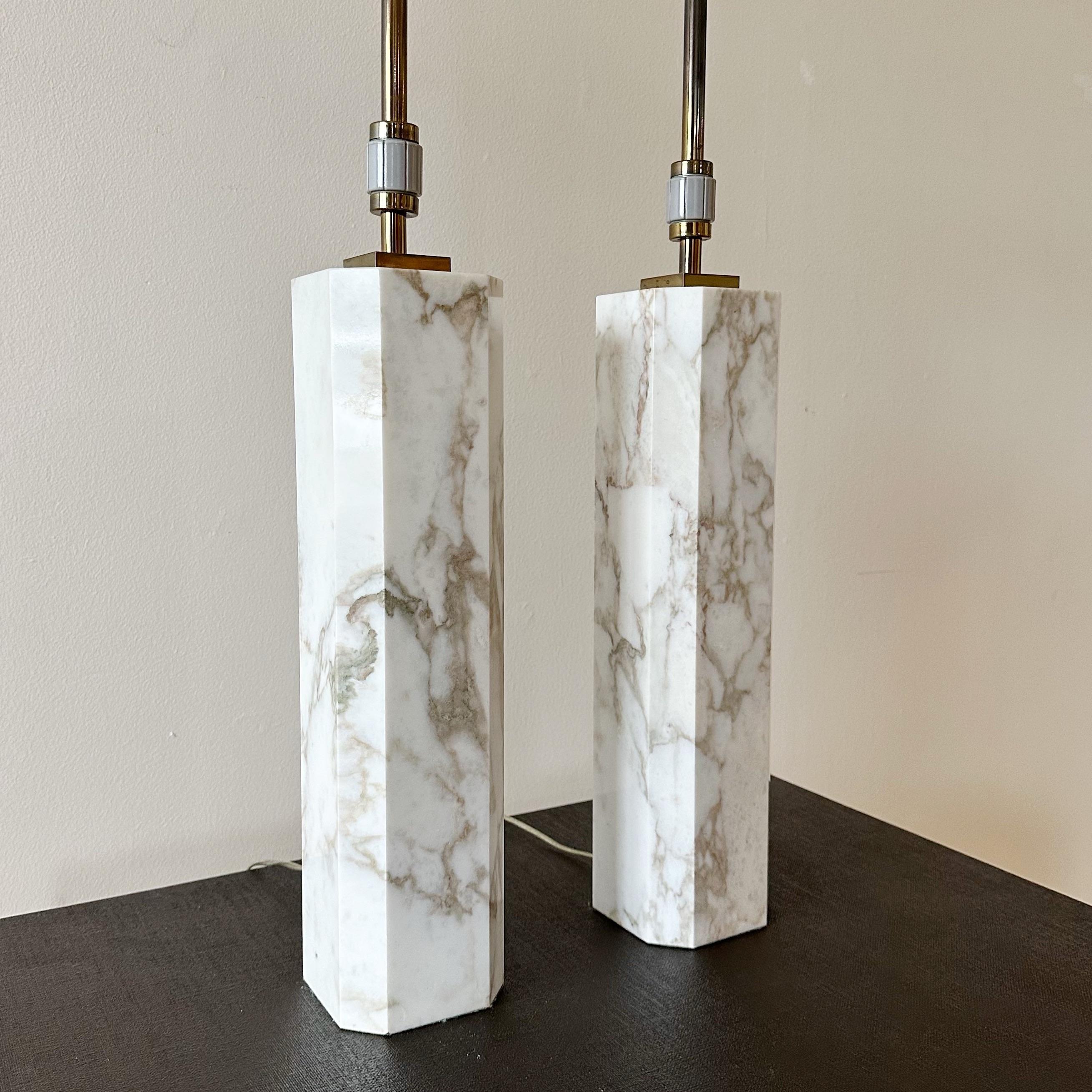 Pair of Carrara marble T. H. Robsjohn-Gibbings for Hansen Lighting of NY table lamps. These lamps have the original fittings and working 3 way twisting switch. Measure 35