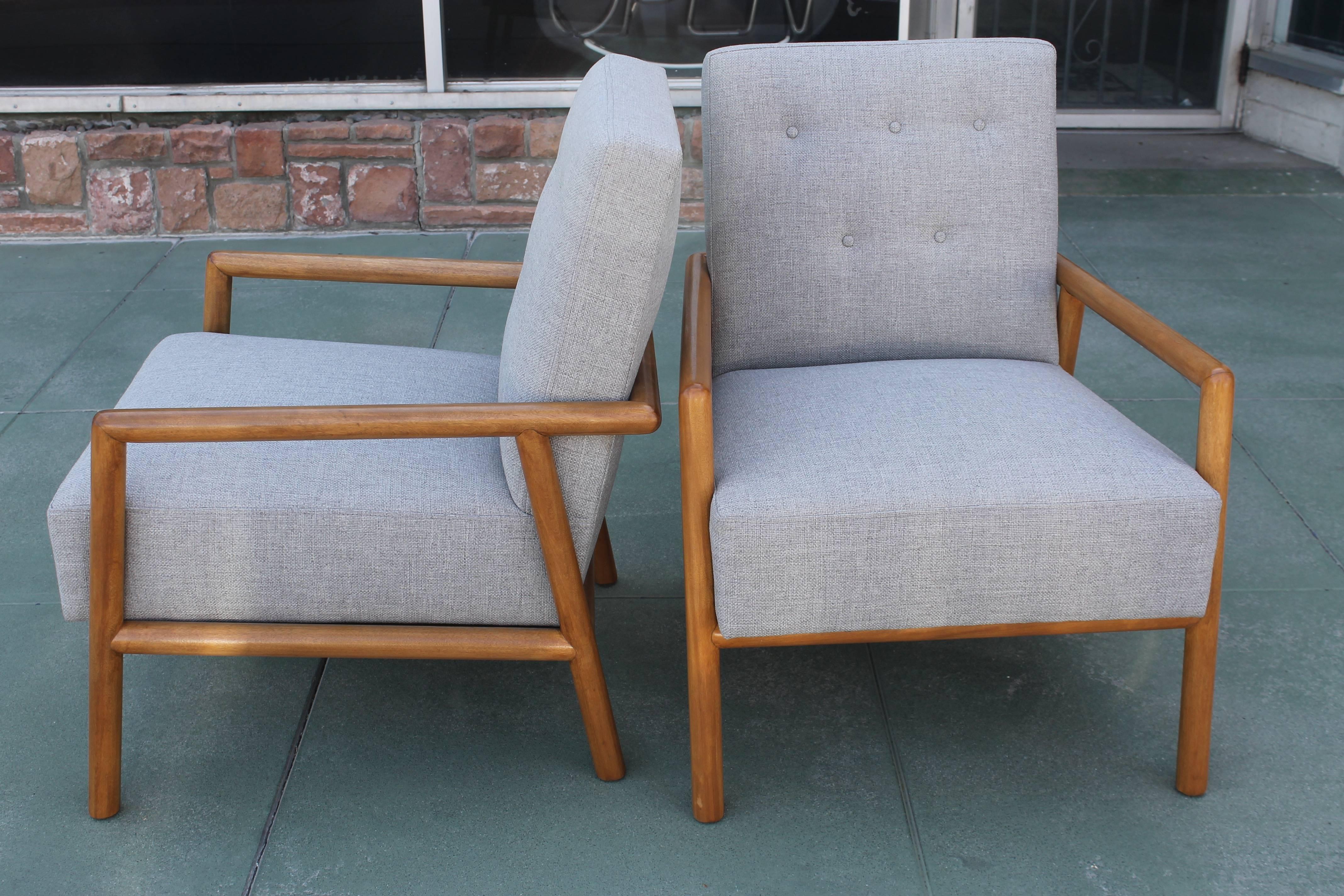 Pair of T. H. Robsjohn-Gibbings lounge chairs. These are the smaller versions. These chairs have been in one owners house since the late 1950s. They were featured on the cover of Interior Design magazine dated February, 1960. We had them