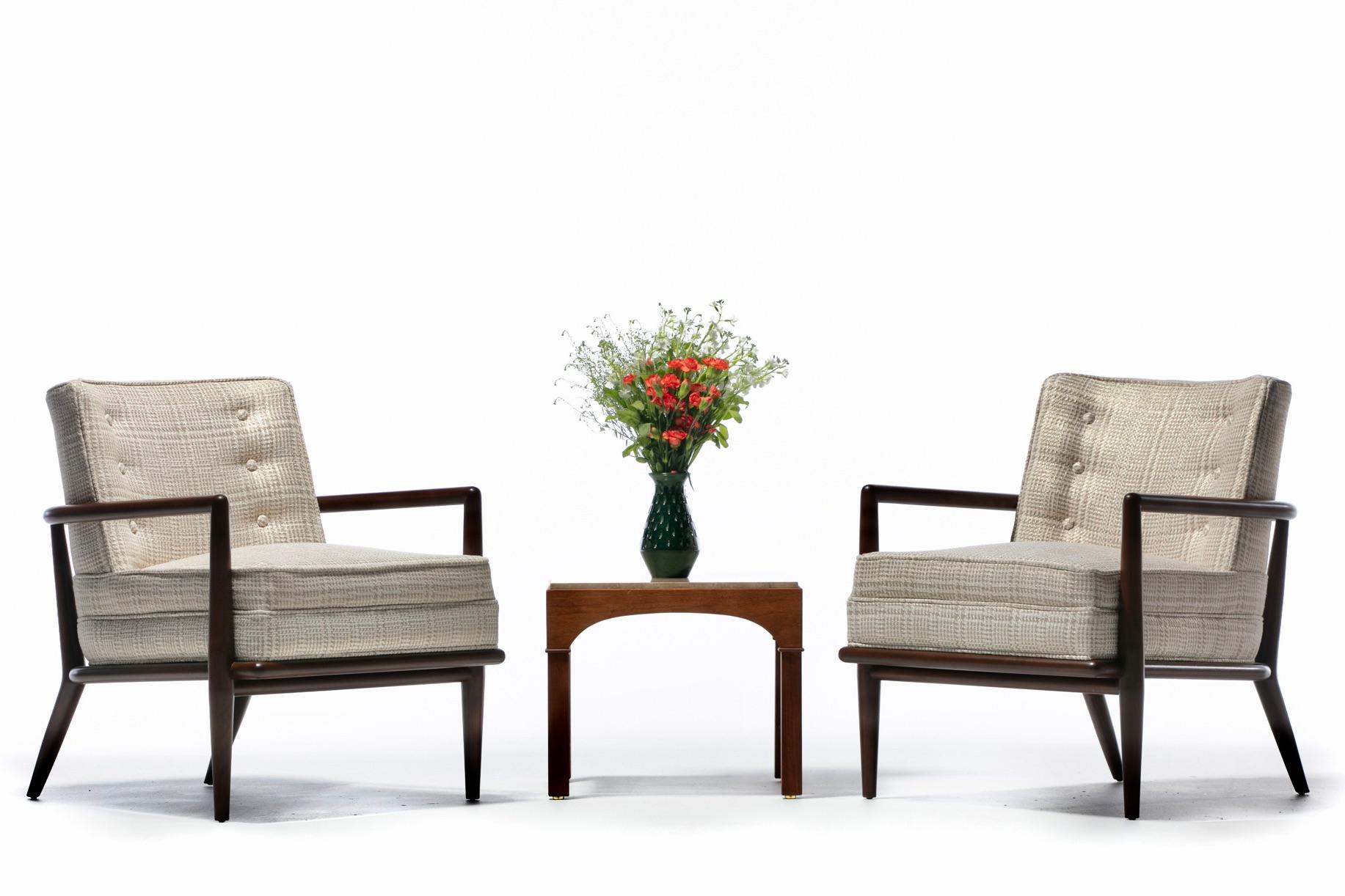 Pair of 1950s iconic walnut Lounge Chairs designed by T. H. Robsjohn-Gibbings and made by Widdicomb newly professionally refinished and reupholstered in designer Romo fabric. Sexy and refined. Classic Mid Century Modern silhouette that's timelessly