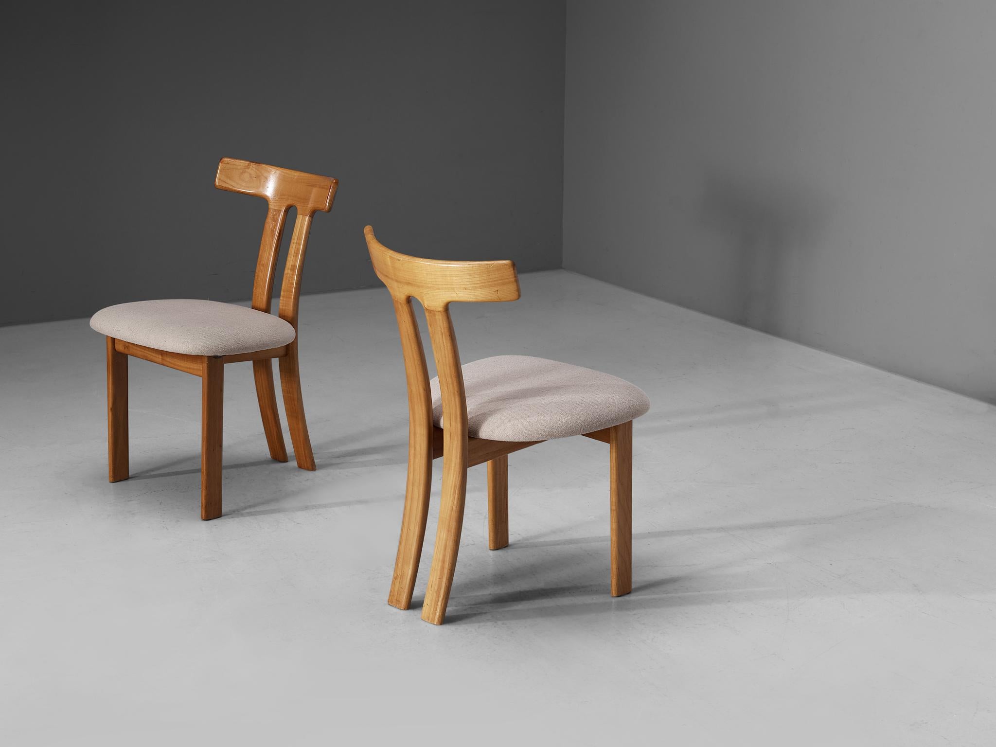 Pair of dining chairs, maple, fabric, France, 1960s. 

These dining chairs have a strong resemblance to Carl Hansen's t-chair and the dining chairs by Sapporo for Mobil Girgi, yet this design is different in its details. Strong vertical and