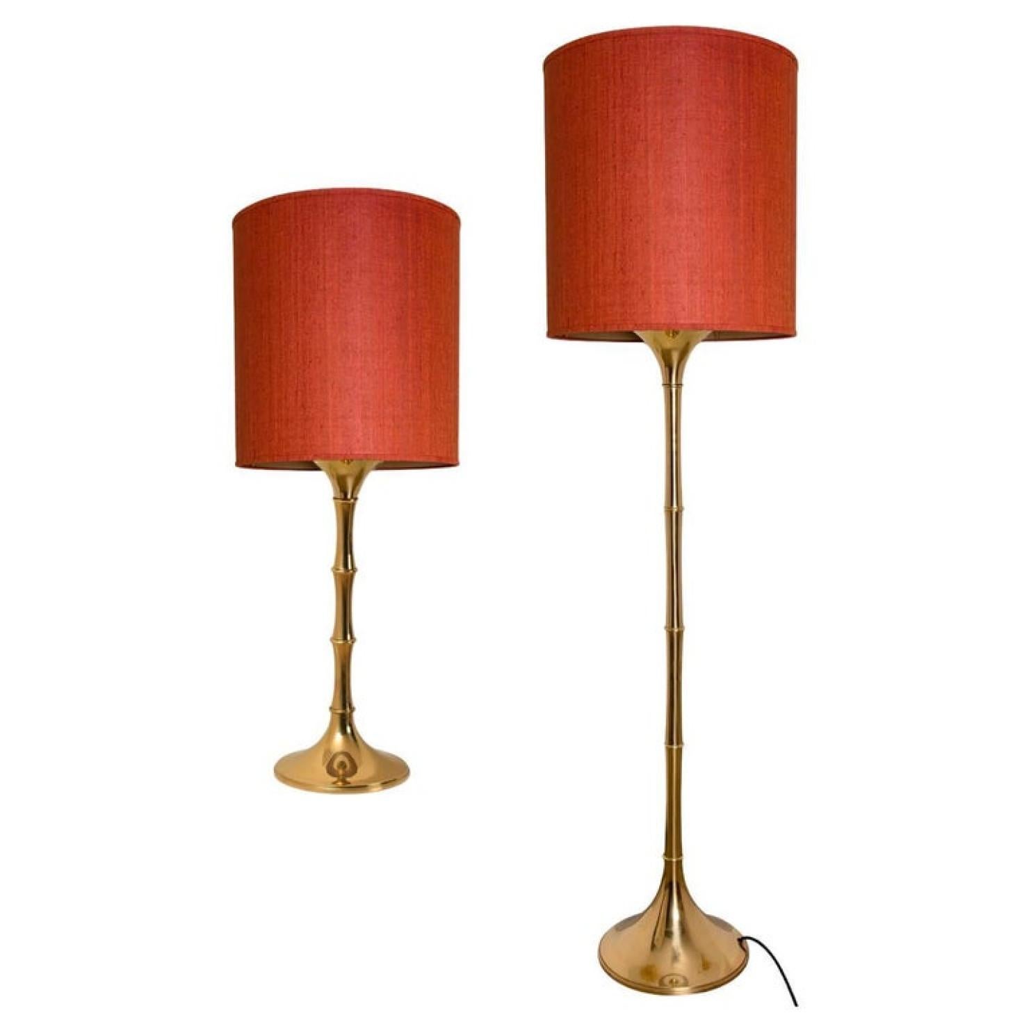 Elegant brass bamboo table and floor lamps Model designed by Ingo Maurer, 1968 for Design M Munich, Germany.
With new gold metal custom made chinenes red silk lamp shades with Bronze inner shade. Made by Rene Houben.

Good original vintage