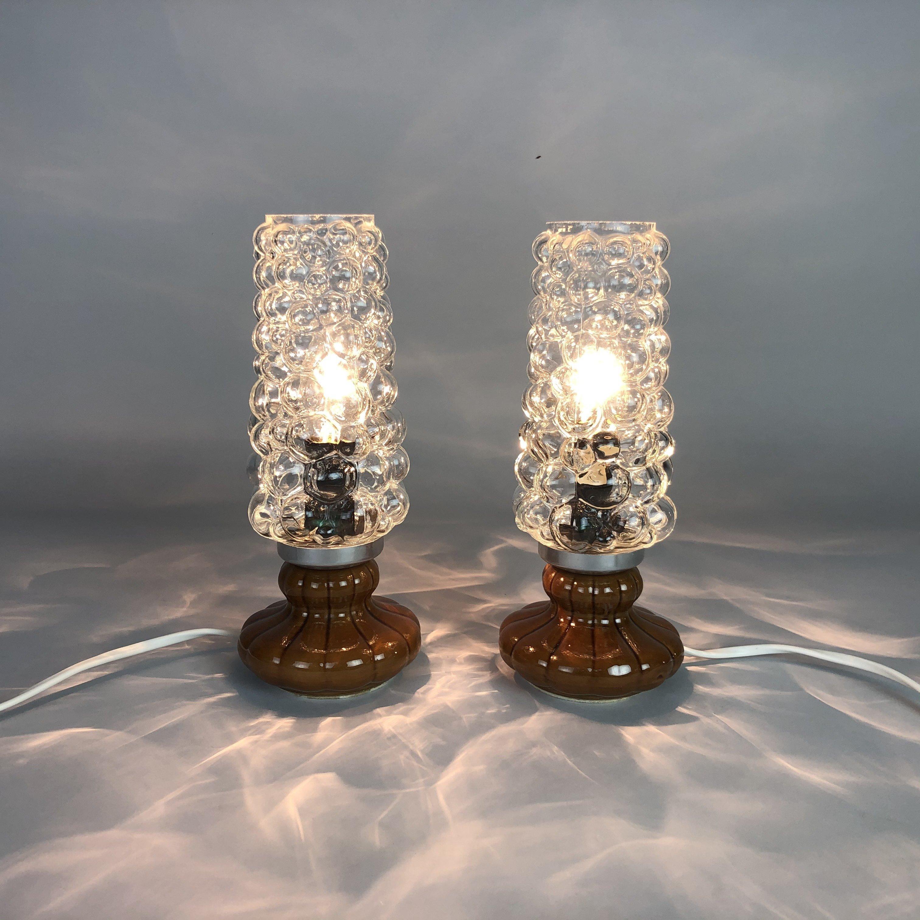 Pair of table or bedside lamps in Helena Tynell style. Ceramic base and bubble glass lamp shades.