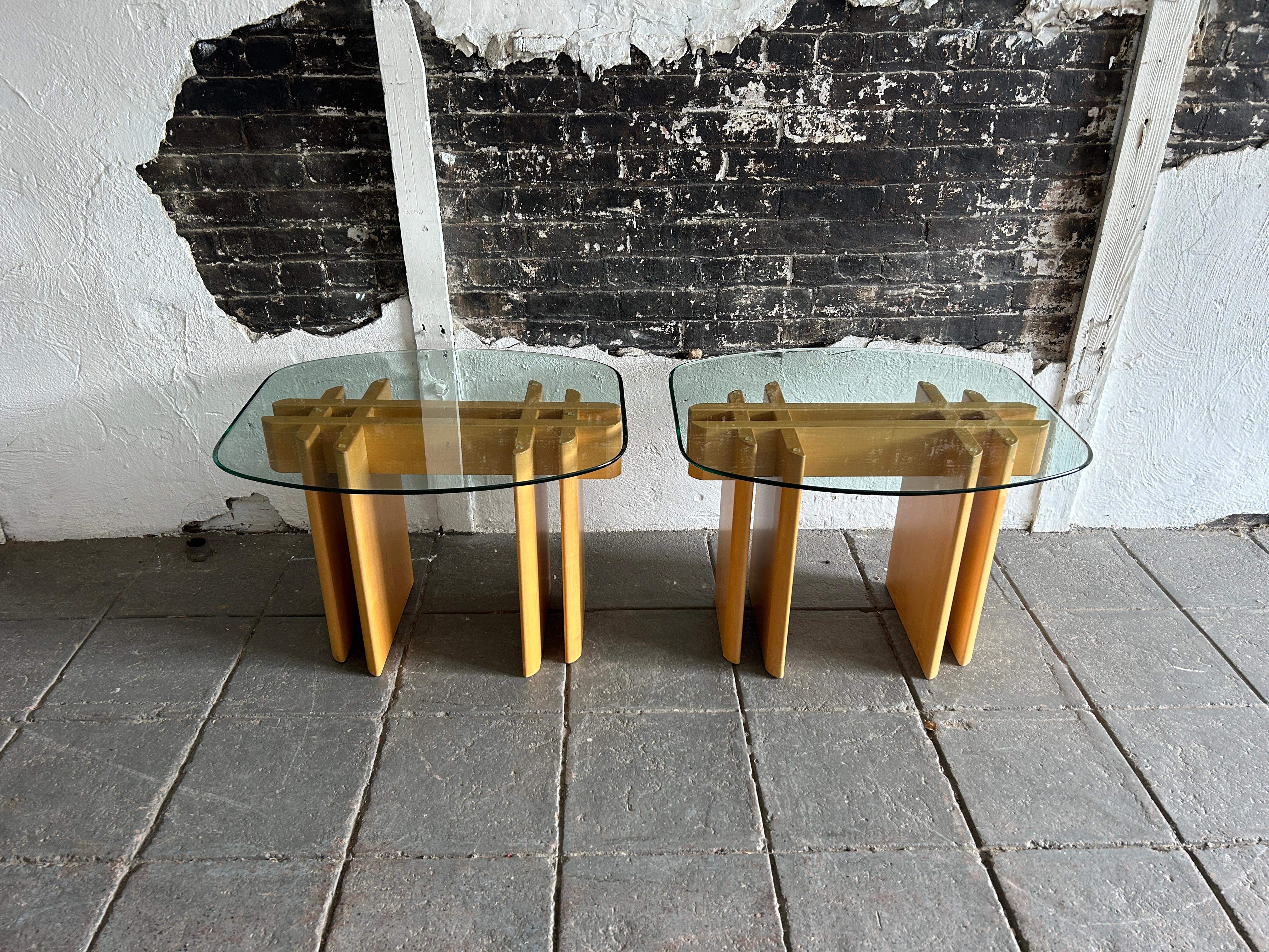 Pair of Table Gustav Gaarde birch and glass end tables.

Sold a as a pair 