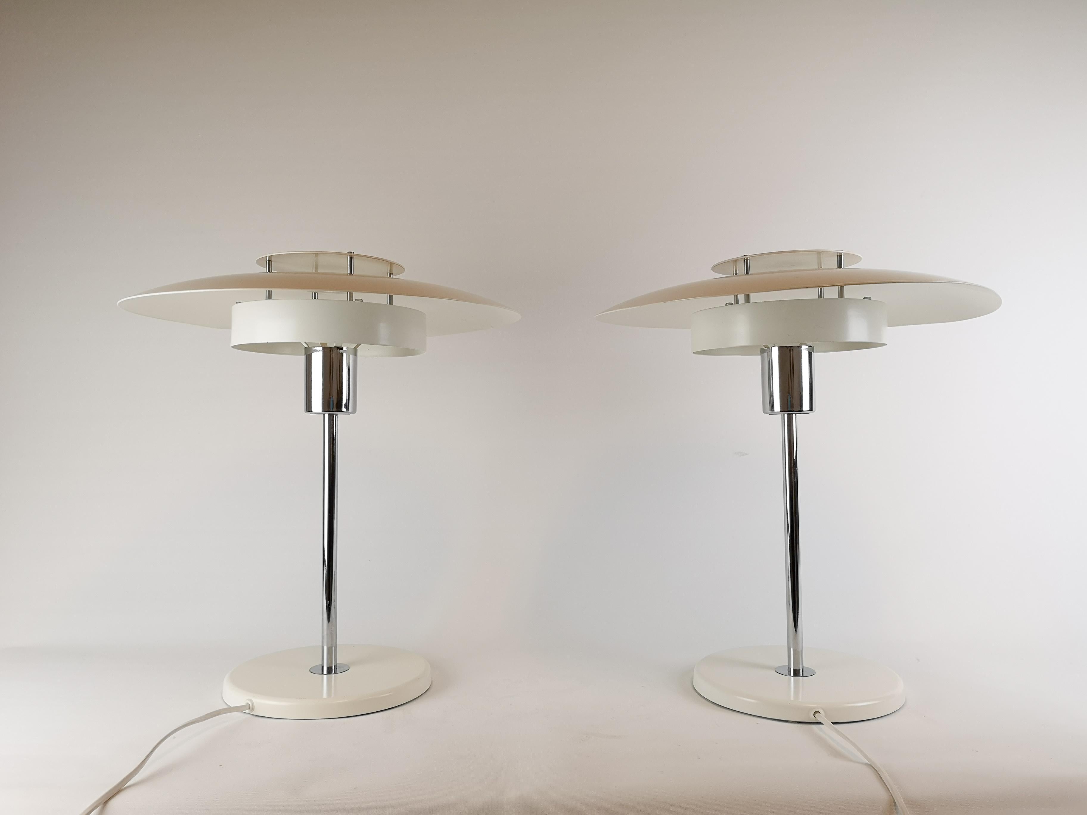 These two table lamps were designed by Ole Andersson and manufactured at Borens Sweden in the 1970s. 

Good working condition, some scratches and marks. 

Measures: H 47 cm, D 40 cm.
 