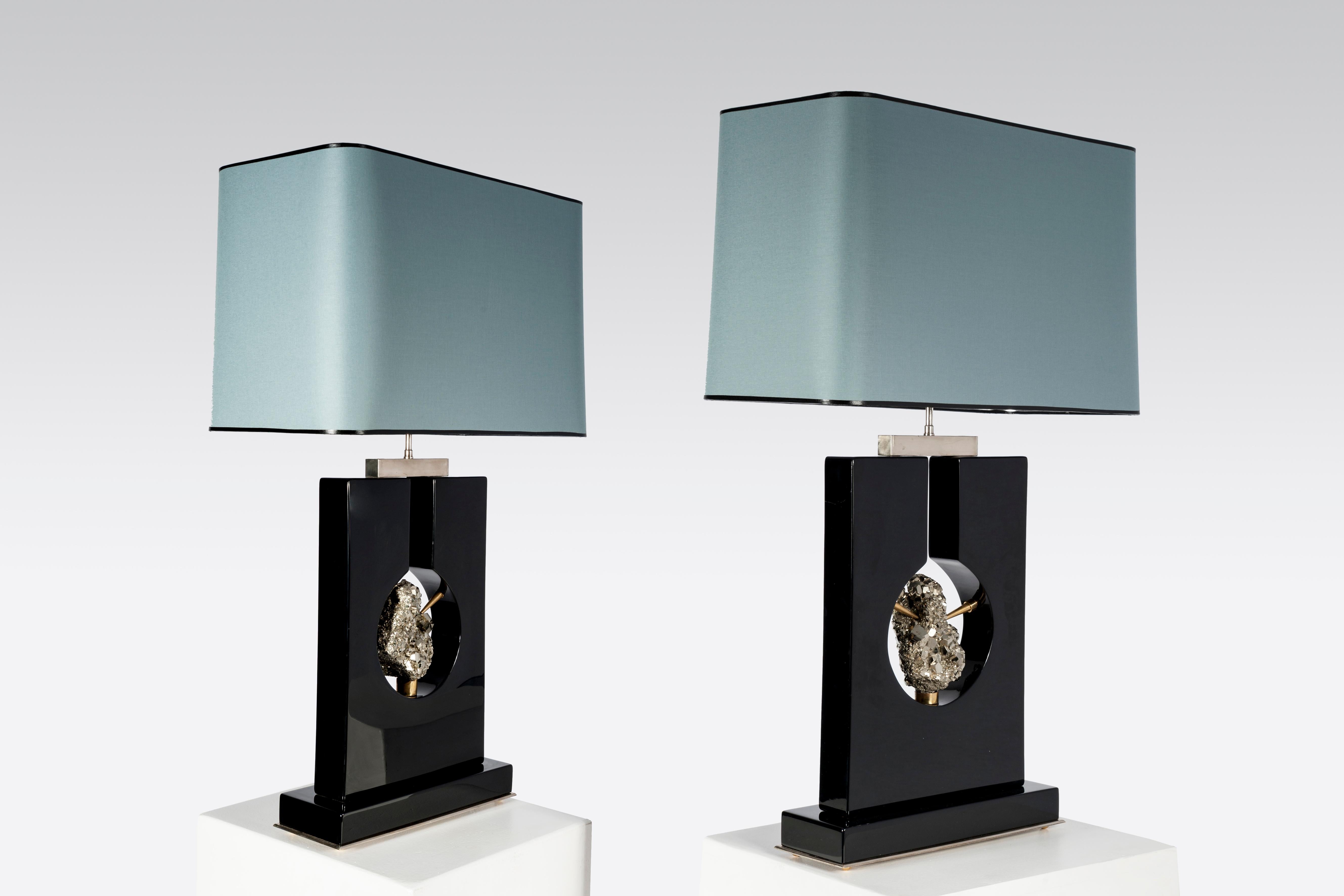 Created to measure by Stan Usel, this pair of twin black resin table lamps inserted with a mixed gold and silver pyrite harbored in each piece gives, when put together aside, a great sense of complementarity . Exceptional craftsmanship with the art