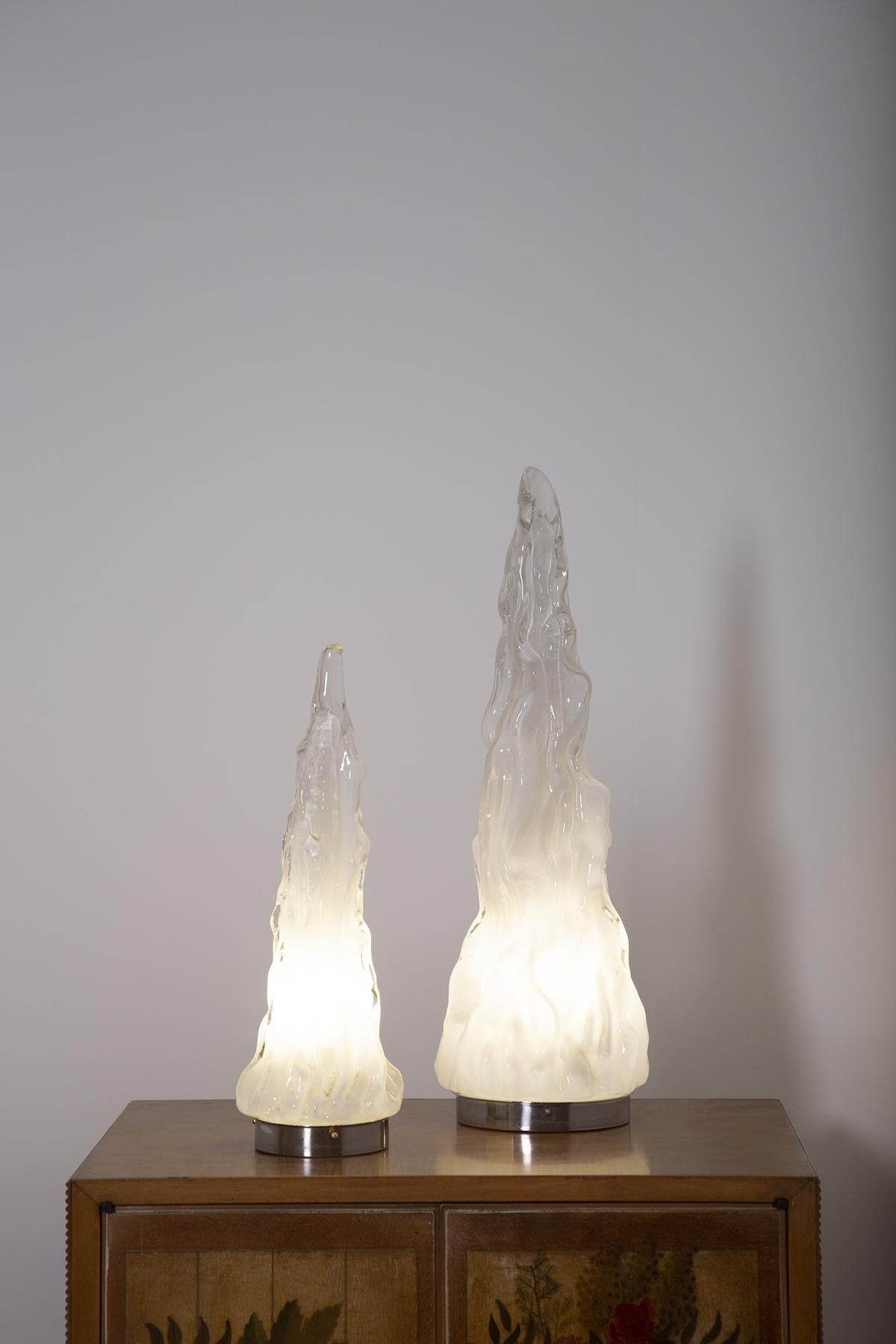 Beautiful pair of table lamps designed by Carlo Nason for the Vistosi manufacture, 1960. The lamps are made of blown Murano and lattimo glass. The lamps have a pyramidal and iceberg shape. Well worked in its shapes it rests on an aluminium base. The