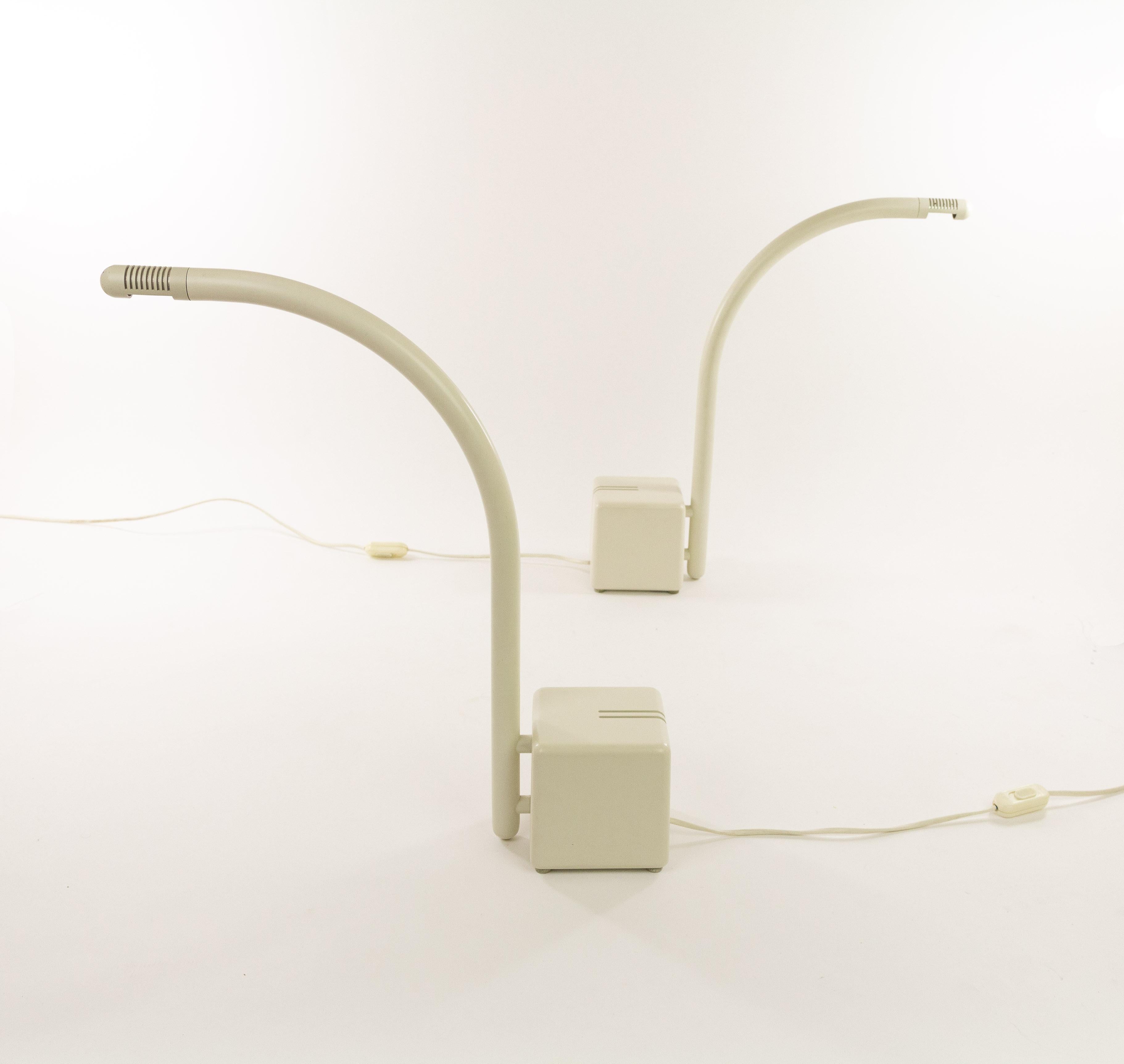 A pair of Minimalist halogen table lamps by Claus Bonderup & Torsten Thorup for Focus Denmark, designed and produced in the 1970s. The Focus article number is 3011.

The transformer of the lamp forms the, rather heavy, base of the lamp. The lamps