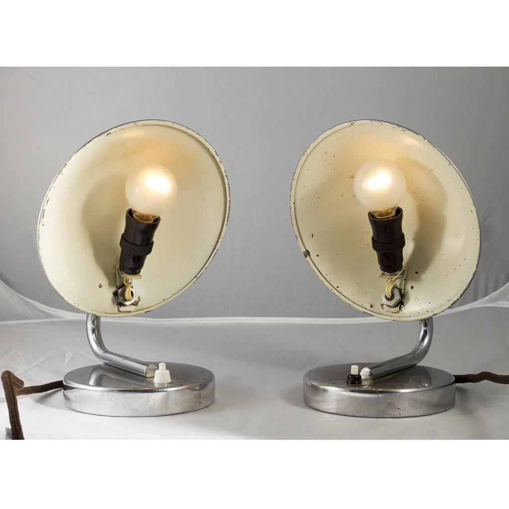 Pair of bedside/table lamps from the twenties, due to the intelligent screen design a glare-free illumination or indirect illumination is possible. 
This pair of lamps is newly wired according to international standards.