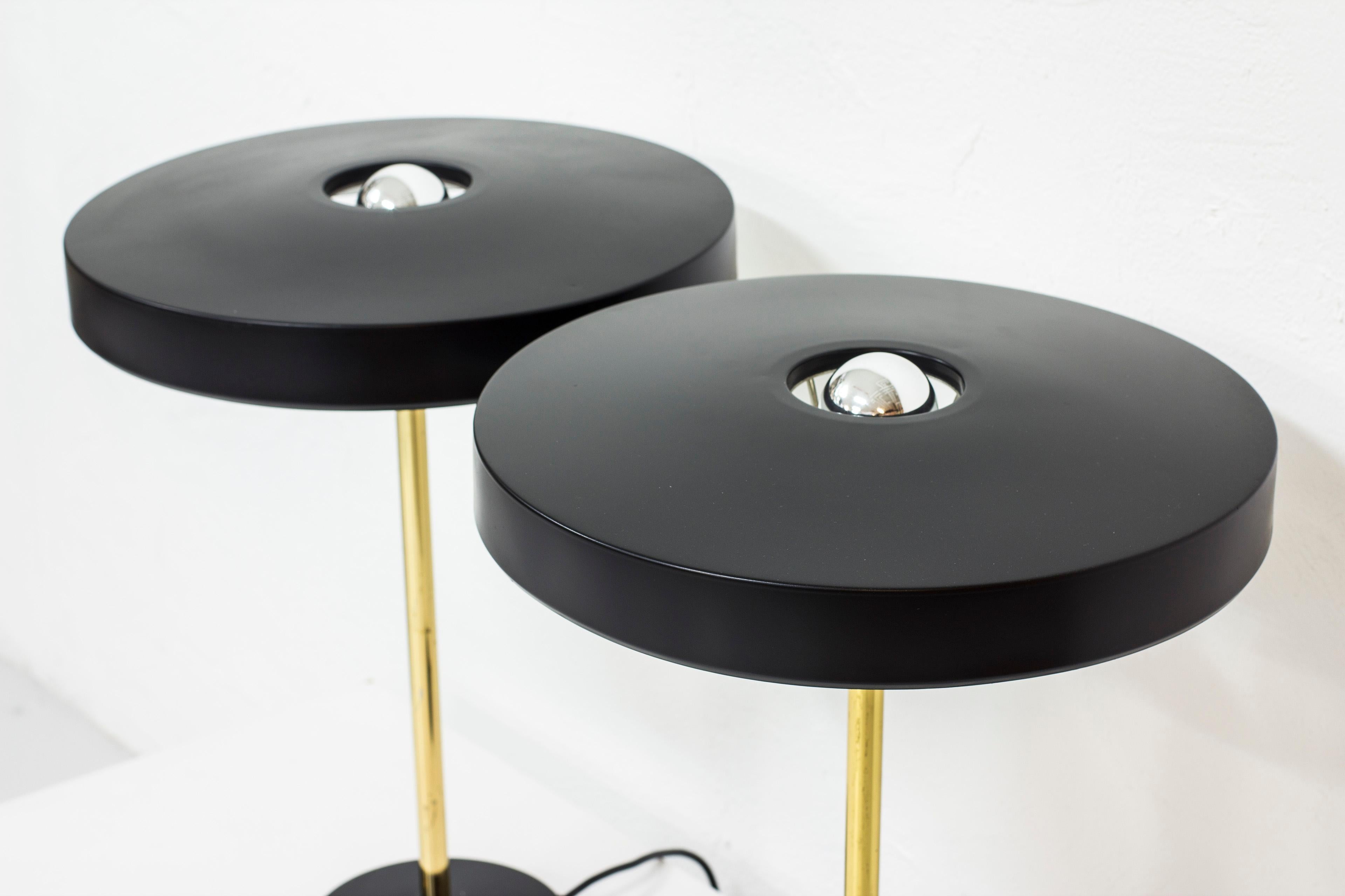 Table lamps designed by Louis Kalff. Produced by Philips in the Netherlands during the 1960s. Black lacquered metal and polished brass. Light switch on the base in working order. Good vintage condition with signs of wear and patina.


Price for