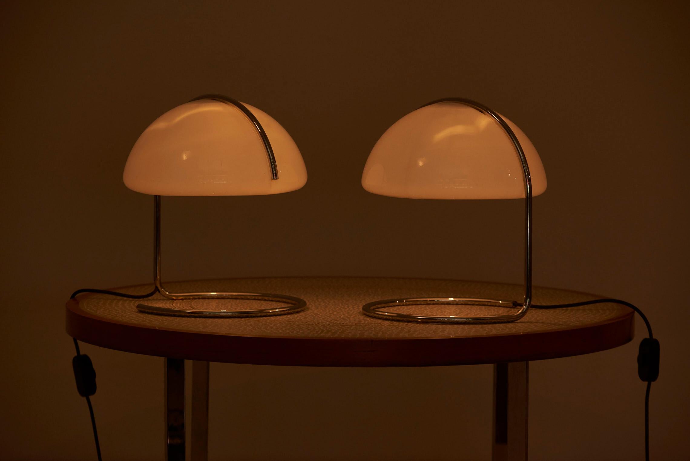 Pair of Space Age table lamps, designed in 1960s by Luigi Massoni & Luciano Buttura and manufactured by Harvey Guzzini in Italy.

1 x E27 socket / each lamp.

Please note: Lamp should be fitted professionally in accordance to local requirements.