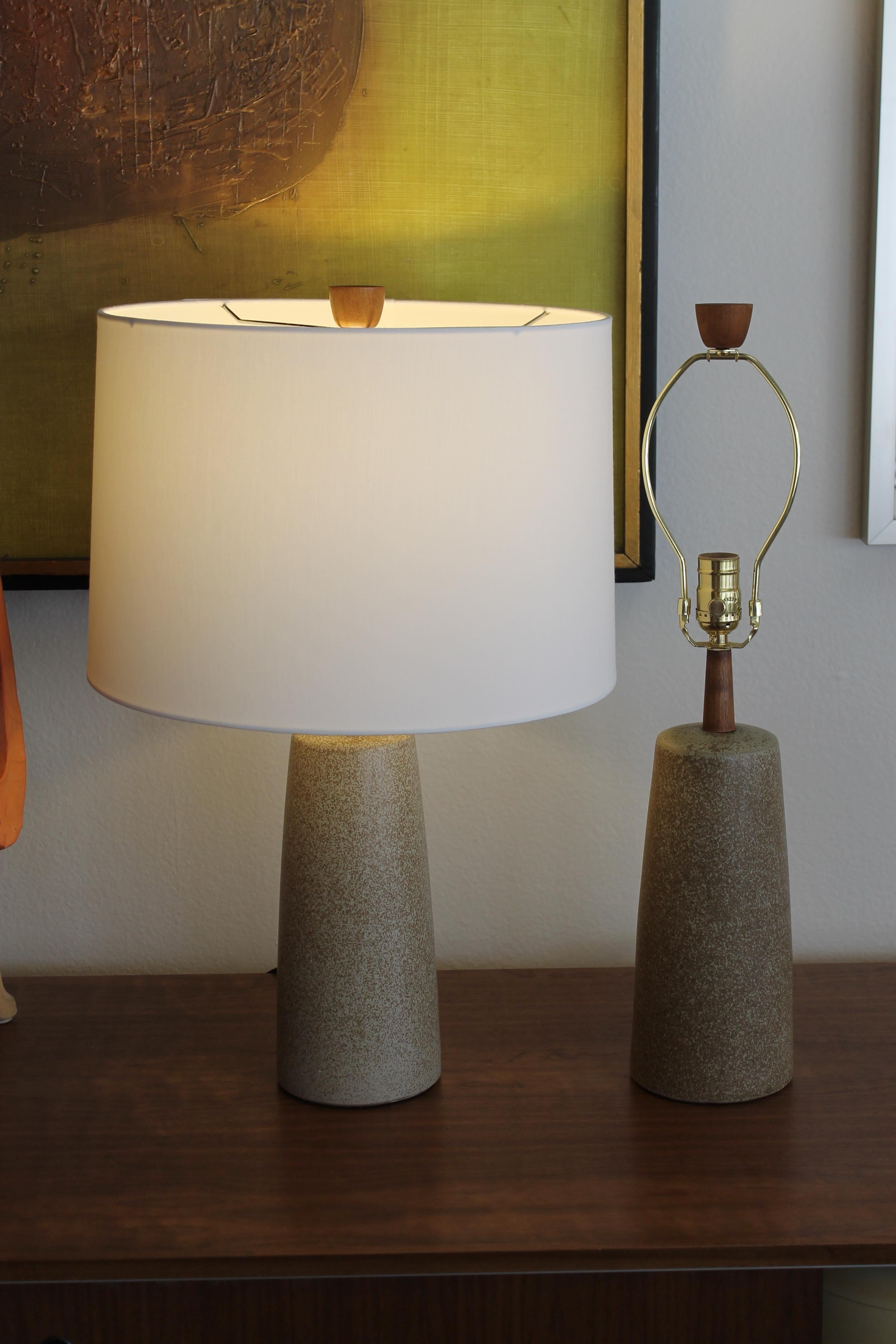 Martz table lamps by Marshall Studios, Inc. Veedersburg, Indiana. One lamp has a paper label in addition to the engraved Martz signature near the cord outlets. Lamps have the original finial and have been professionally rewired for a 3 way light
