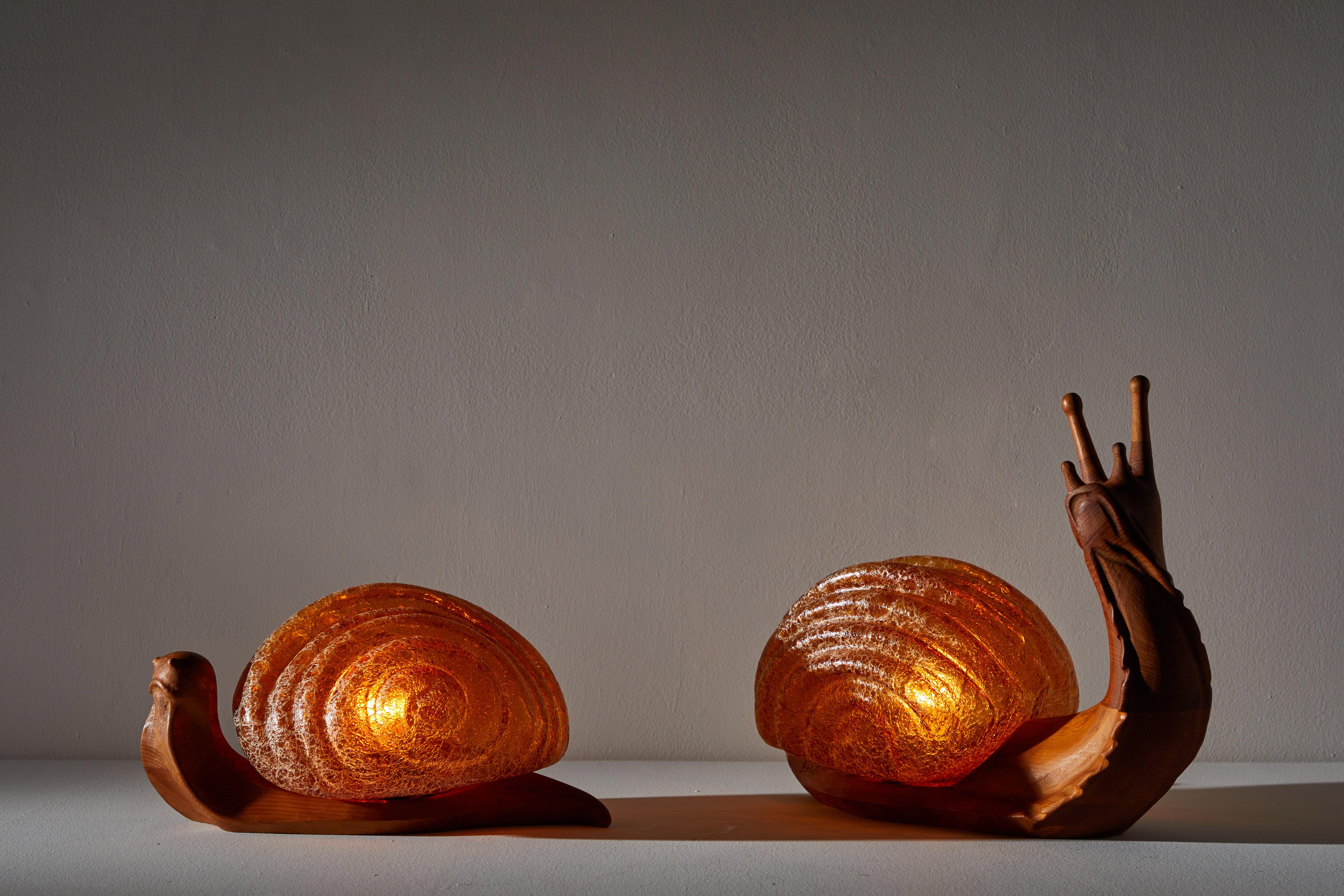 Pair of table lamps by Marzio Cecchi for Dimensione Fuoco. Designed and manufactured in Italy, circa 1970s. Wood and glass. Rewired for U.S. junction boxes. Hand-sculpted wood with impressed signature by author to both lamps. Original cords. Each