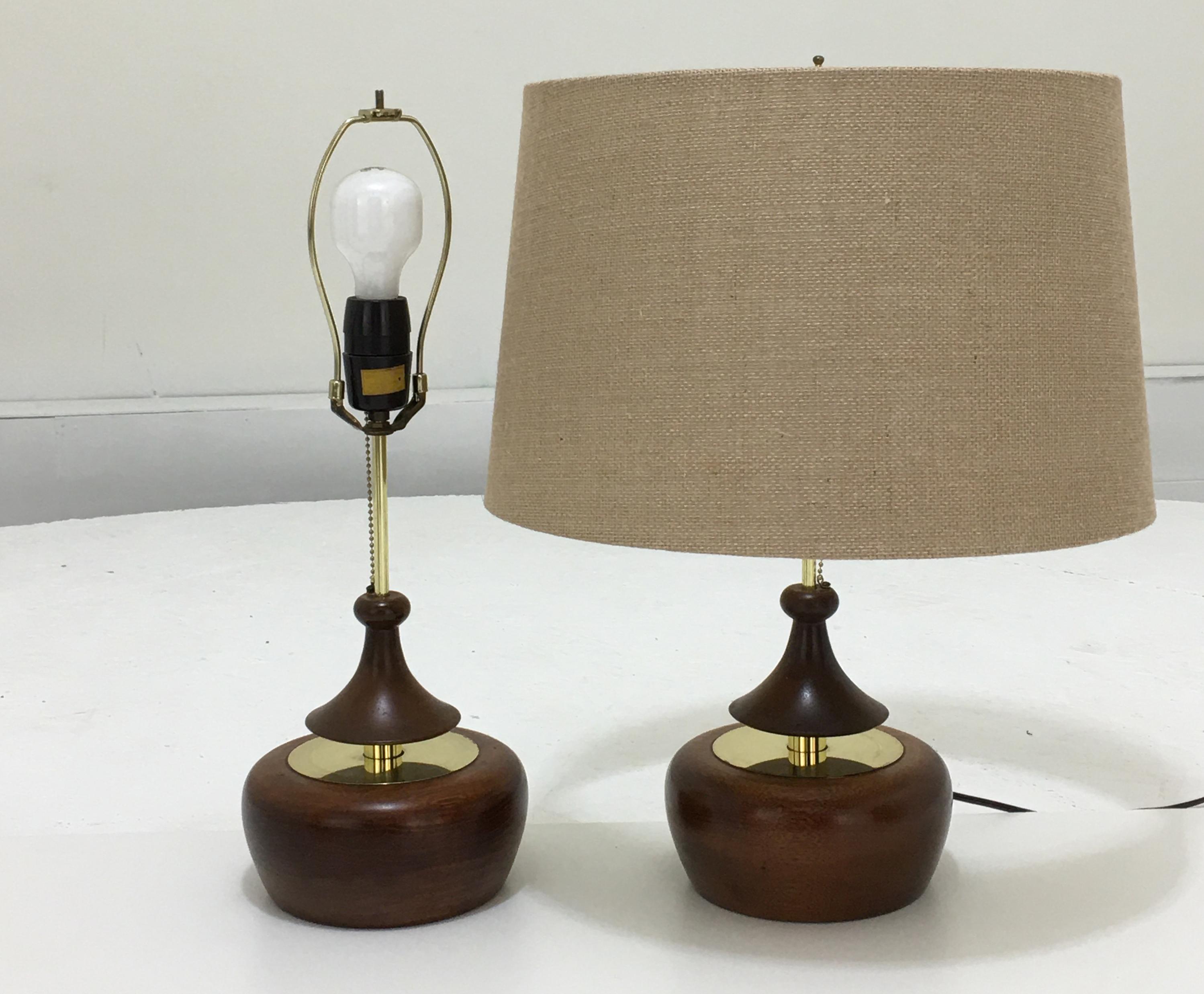 Modeline, California, USA circa 1960, each lamp 7.5 wide and 22 inches tall.
Modeline of California was a creative company located in California that specialized in producing Danish style Mid-Century Modern lamps from teak, walnut and Myrtle wood.