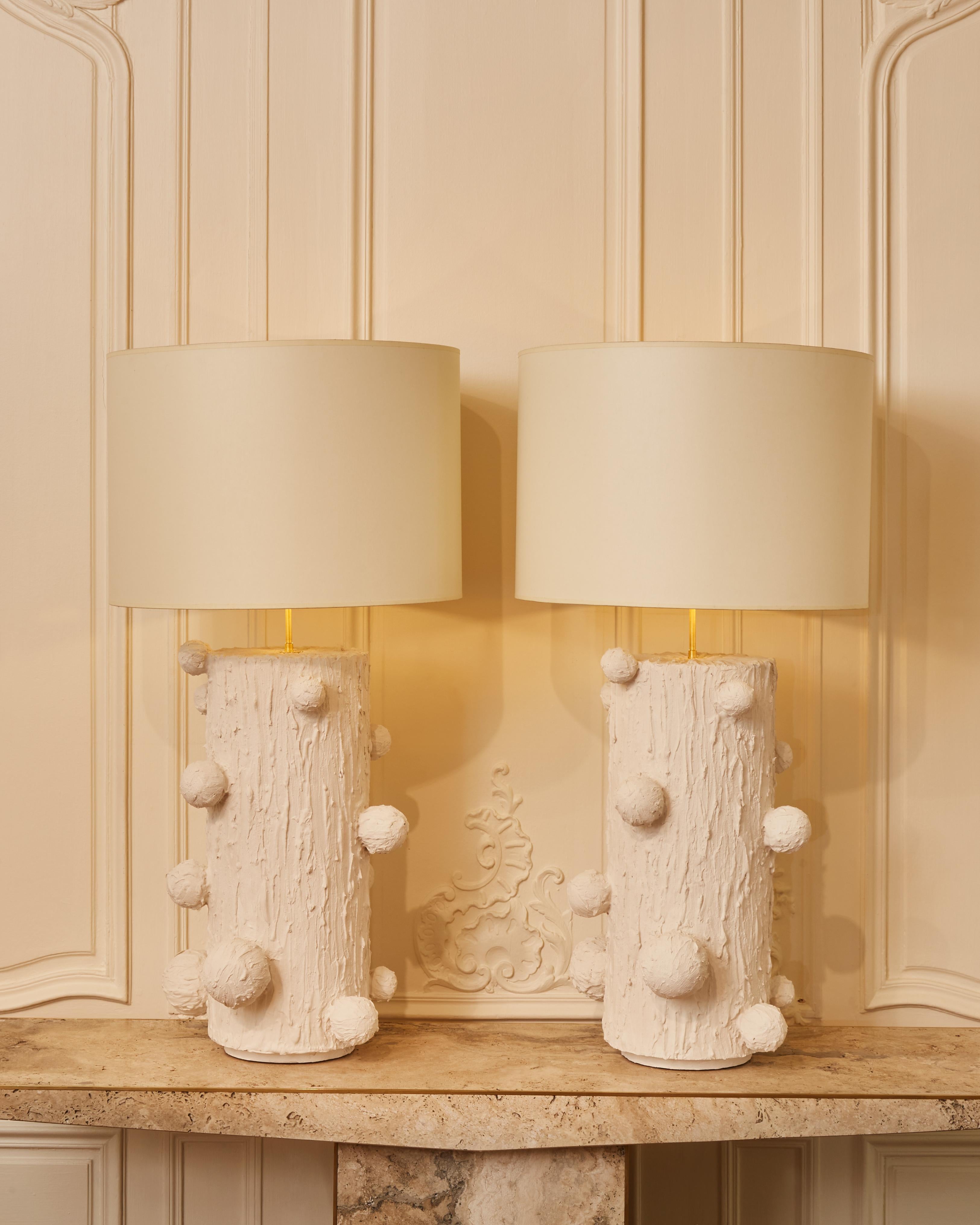 Superb pair of table lamps in sculpted plaster signed by the french artist G. Nicolet.
     