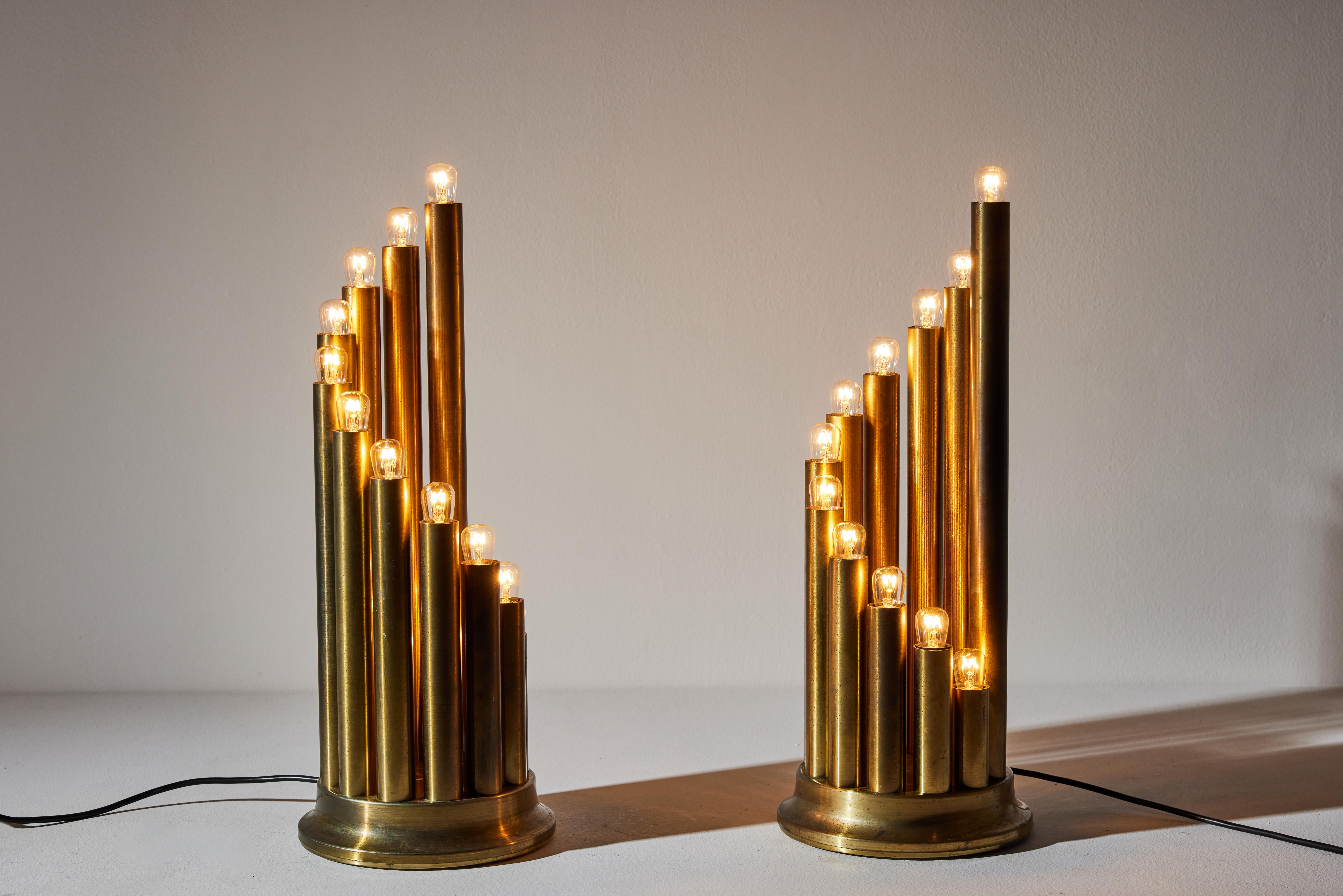 Pair of table lamps by Reggiani. Manufactured in Italy, circa 1970s. Brass. Original European cords. We recommend twelve E14 10w maximum bulbs per fixture. Bulbs provided as a one time courtesy. Priced and sold as a pair.