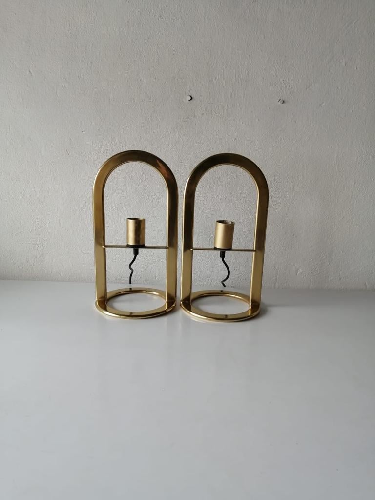 Gold metal pair of table lamps Model Arco 40 by VD, 1980s Germany 

Minimal design
Very high quality. 
Fully functional.
Original cable and plug. These lamps is suitable for EU plug socket. Switch on-off on the cable. 
Manufactured in