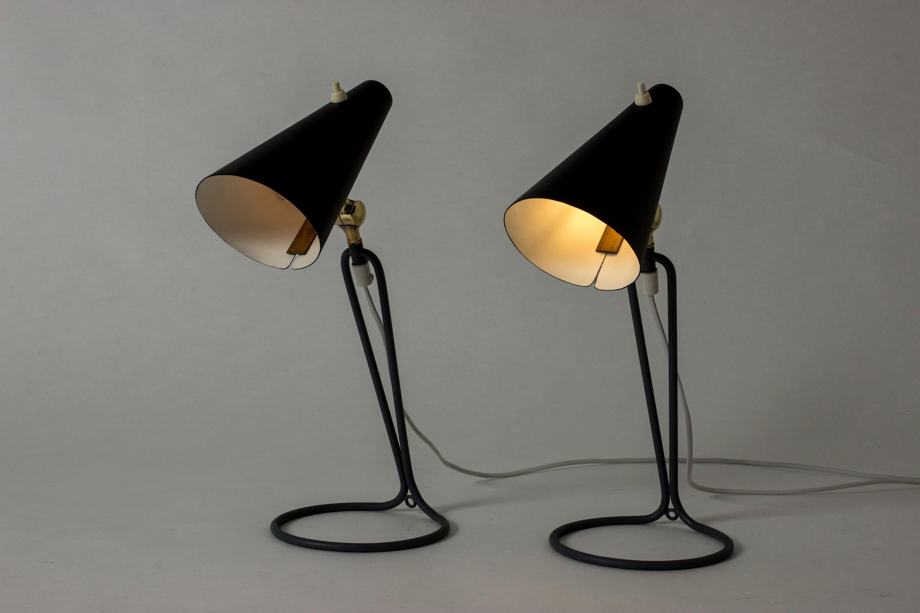 Pair of amazing table lamps by Bertil Brisborg, with black lacquered shades. Cool grey base in a slender graphic design. Contrasting brass joints.