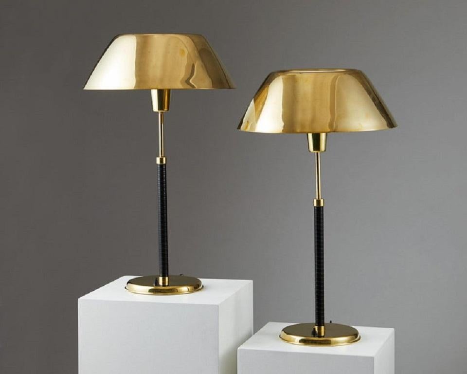 Brass and nylon.

The brass shades on these lamps make them particularly rare.

Measures: Height 70 cm/ 2' 3 1/2