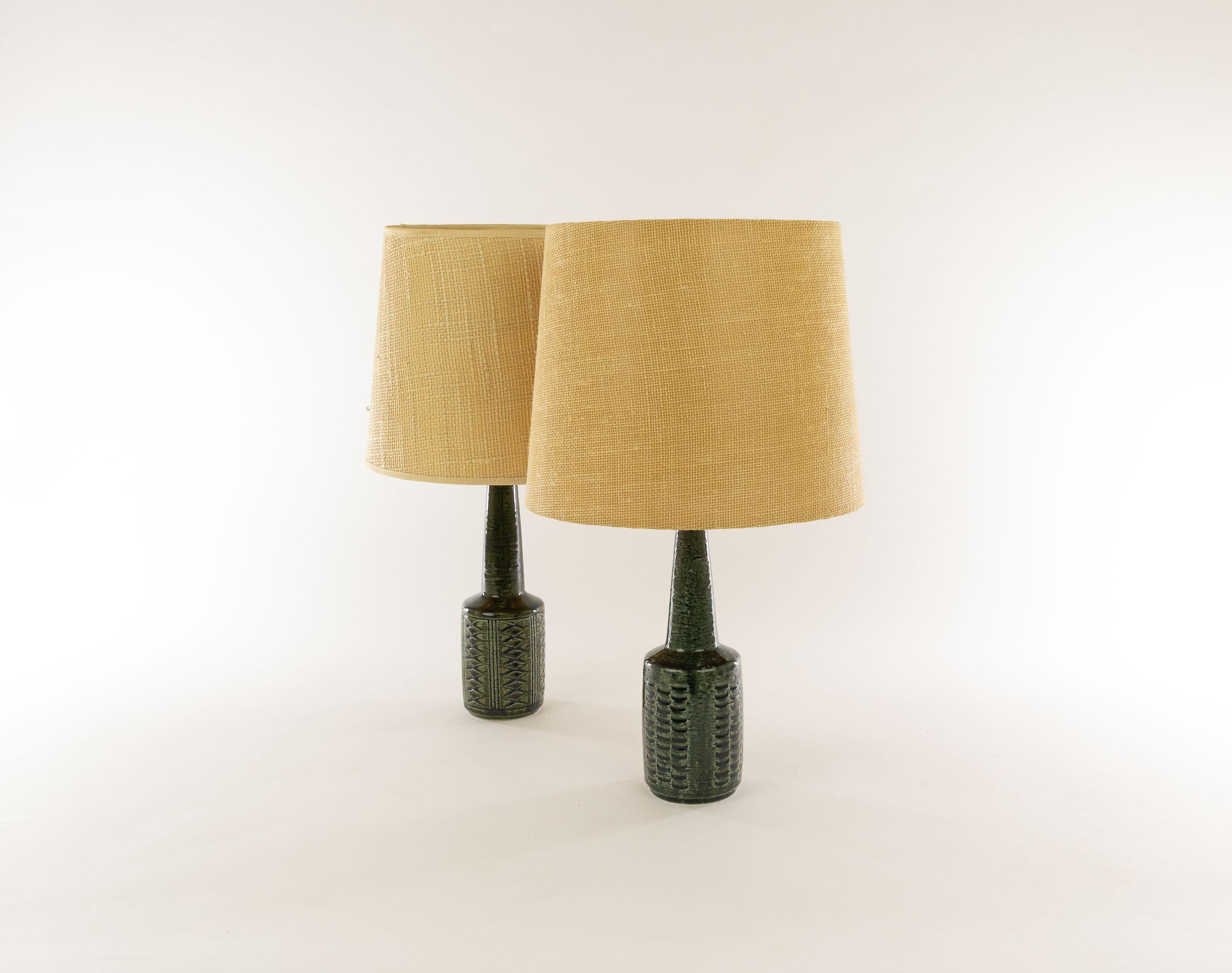 Two charming Danish chamotte (texture clay) table lamps model DL/21 with impressed decoration by Annelise and Per Linnemann-Schmidt for Palshus, Denmark, 1960s.

Palshus produced a wide range of table lamps, in different patterns, height and