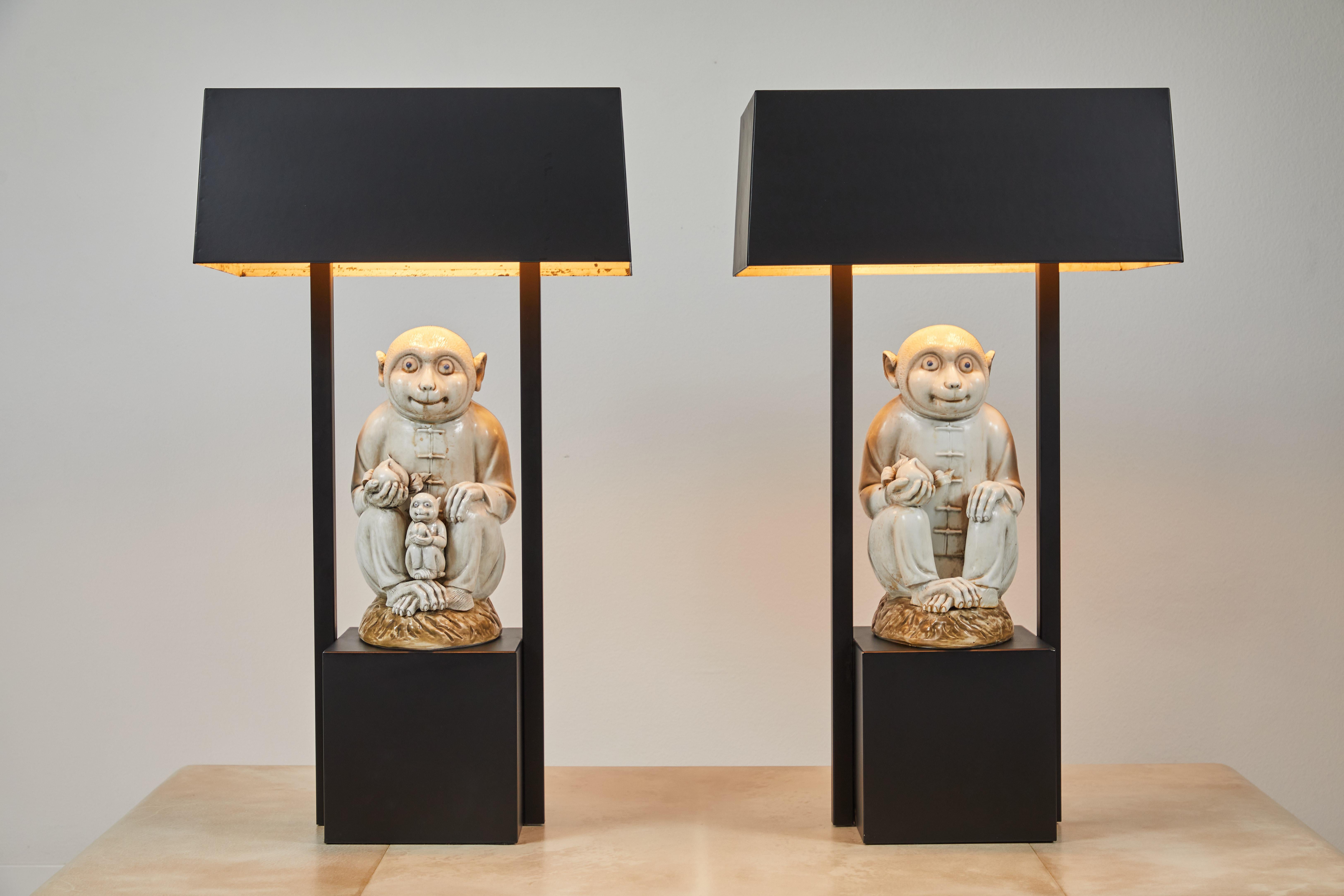 A unique and rare pair of painted metal lamps, both base and shades. These lamps are from the estate of Tony Duquette and still retain their Christies lot stickers. As seen in image #5. They have been repainted and rewired. The same model of lamp
