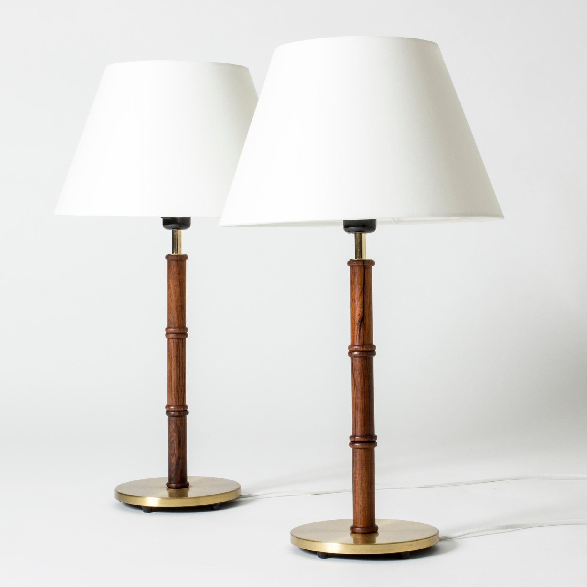 Pair of cool table lamps from Falkenbergs Belysning, made from brass with a rosewood stem. Wood elegantly carved into a bamboo-stem form.