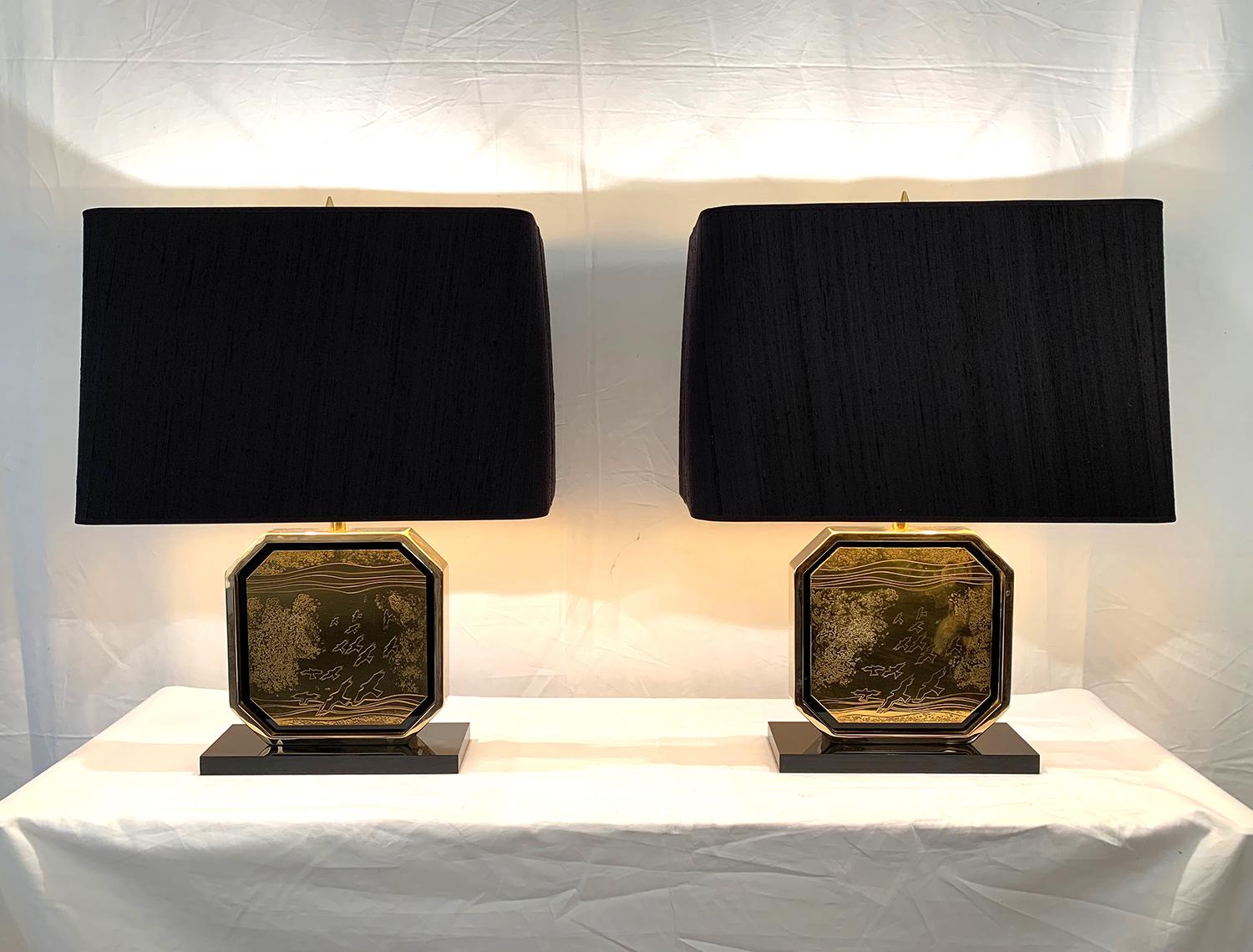 Fabulous pair of table lamps in 24-carat gold, brass and black Lucite designed by Georges Mathias in the 1970s. The lamps are signed and numbered 115 and 116 on 250. The lamp is signed 