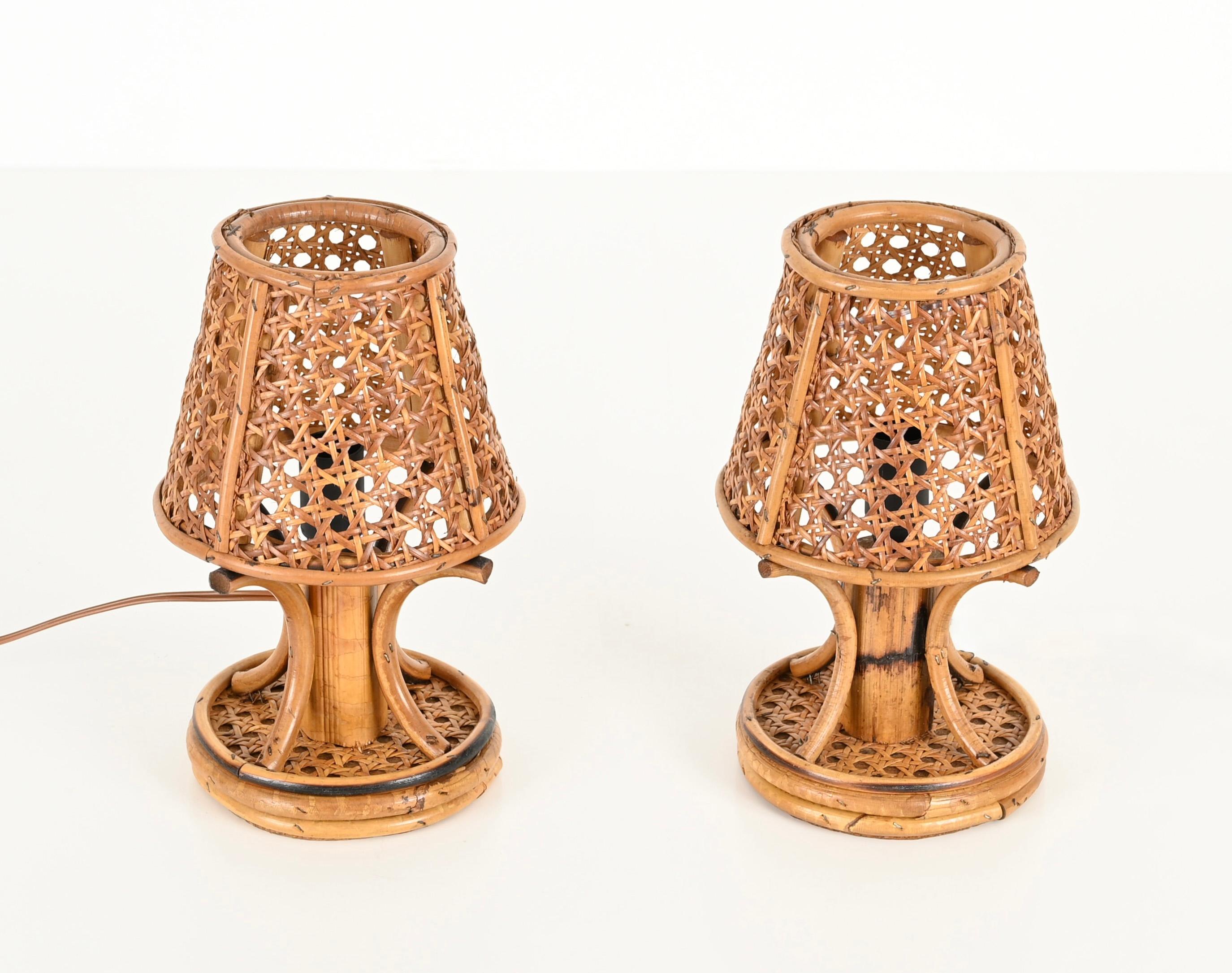 Delightful pair of French Riviera style table lamps fully made in bamboo, rattan and Vienna straw. This lovely organic table lamps were made in Italy during the 1960s, clearly in the style of Louis Sognot. 

In amazing conditions and with a