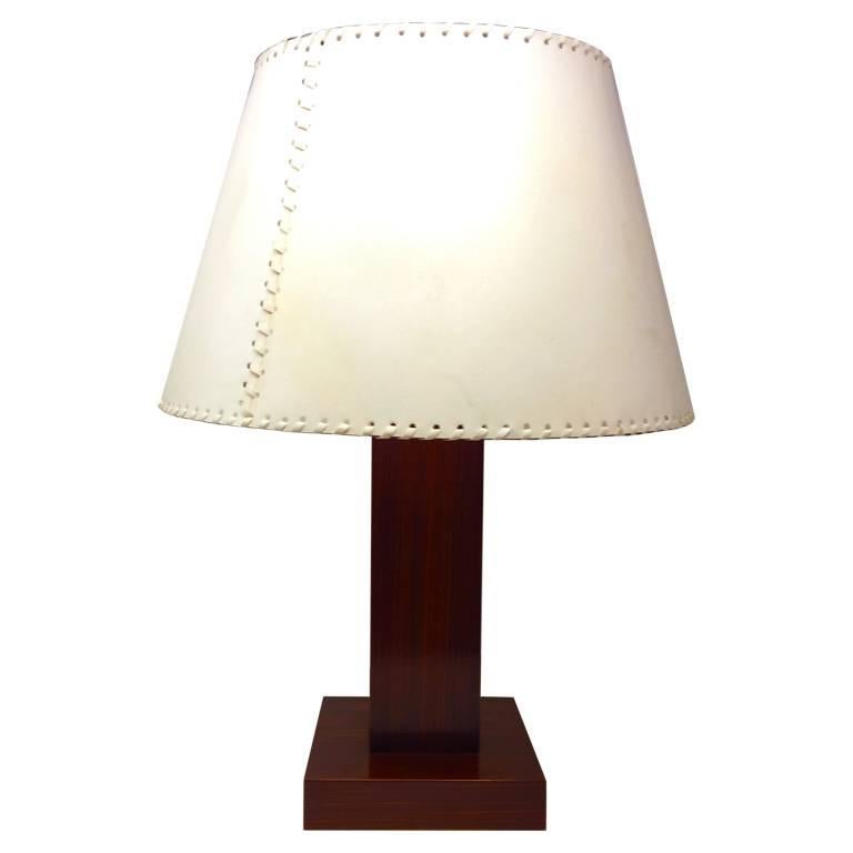 Astonishing pair of table lamps in parchment and wood designed by Michel Leo, Made in Italy.