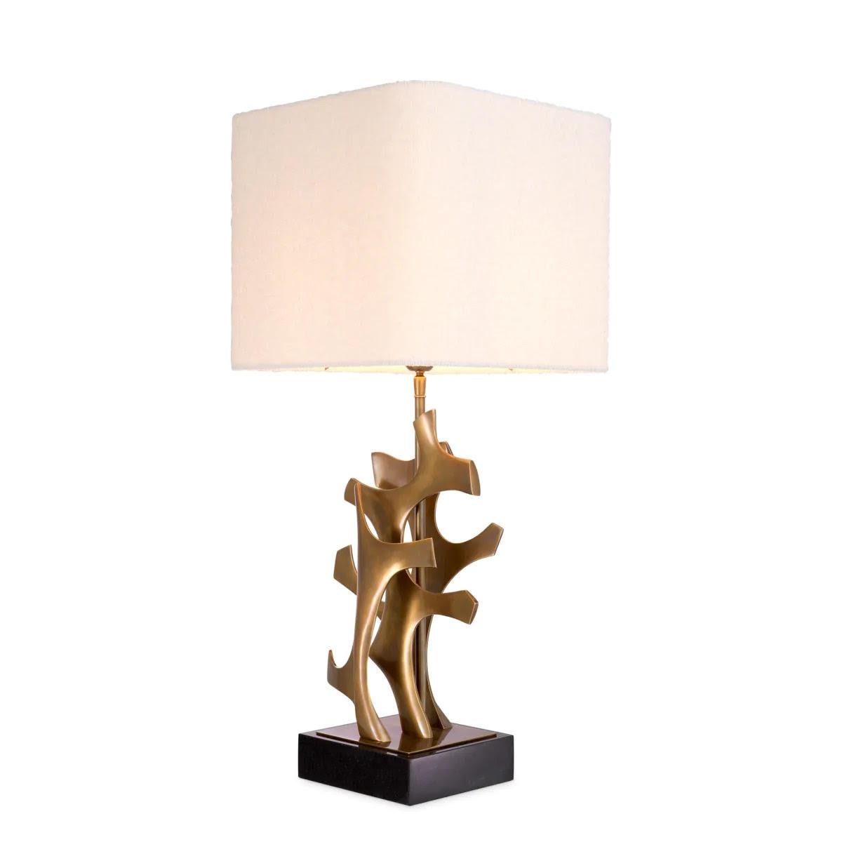 Pair of table lamps in patinated brass with black granite base.

This pair of patinated brass table lamps will add an artistic touch to your decor. It features a sculptural body with organic appeal that rests on a black granite base and is