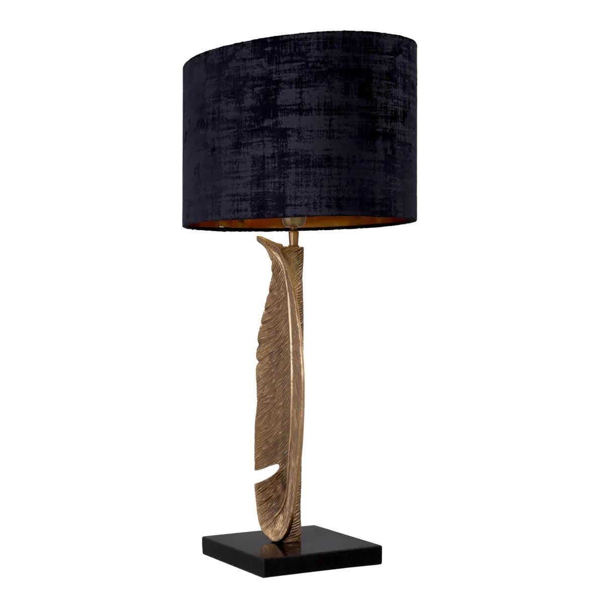 Pair of table lamps in patinated brass with black granite bases.

With its bold mix of textures, this pair of table lamps will add a touch of sophisticated elegance to any room.
Resting on a black granite base, the lamp body features a patinated