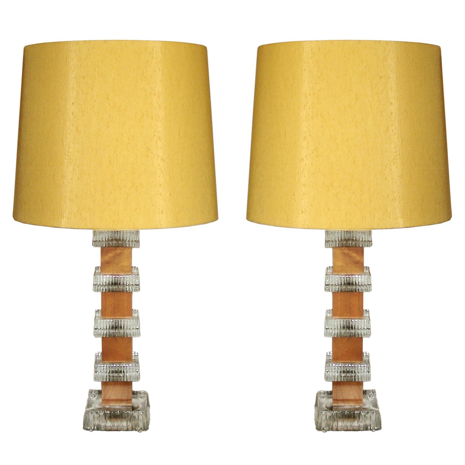 Pair of tall table lamps with assemblage style bases by Ateljé Glas & Trä, with molded glass squares ridged on sides, alternating with blocks of teak, Sweden, 1960s
Original lampshades in silk fabric (shantung look) available, one of them shows some