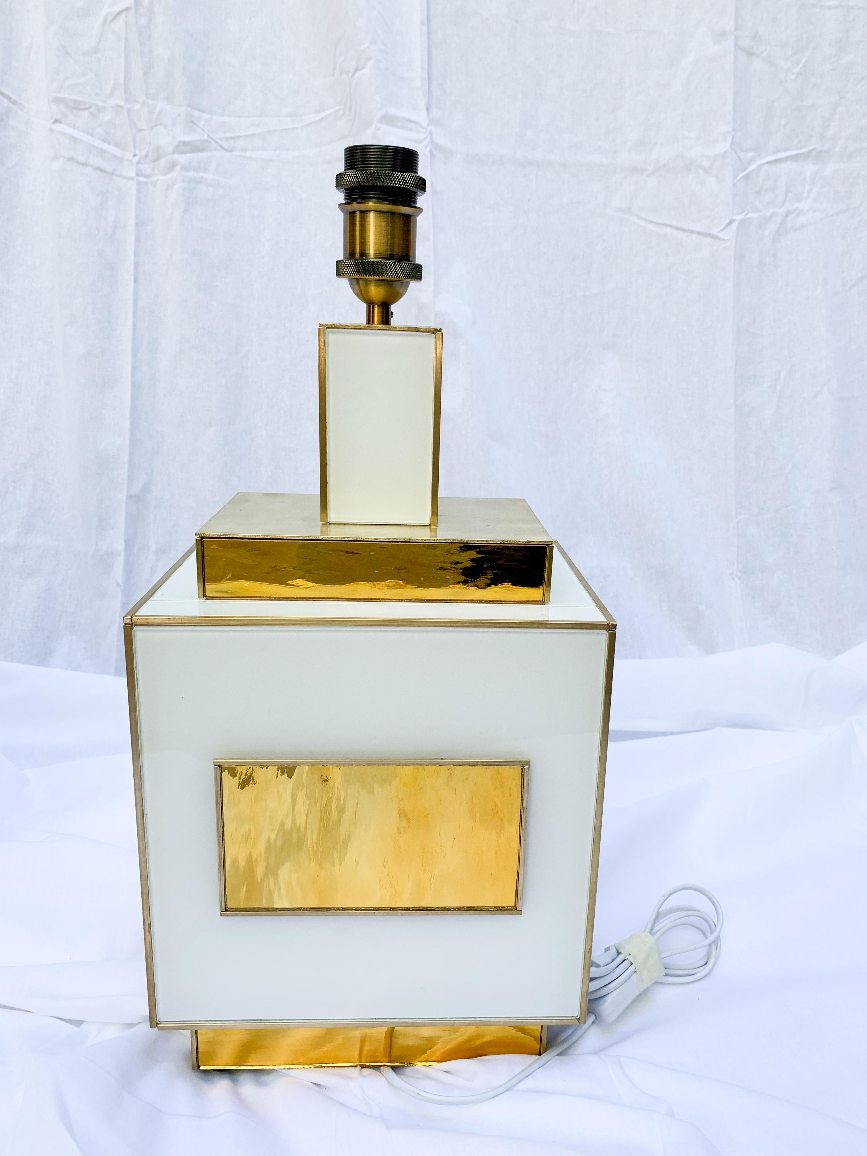 Pair of table lamps in white and gold tinted glass.